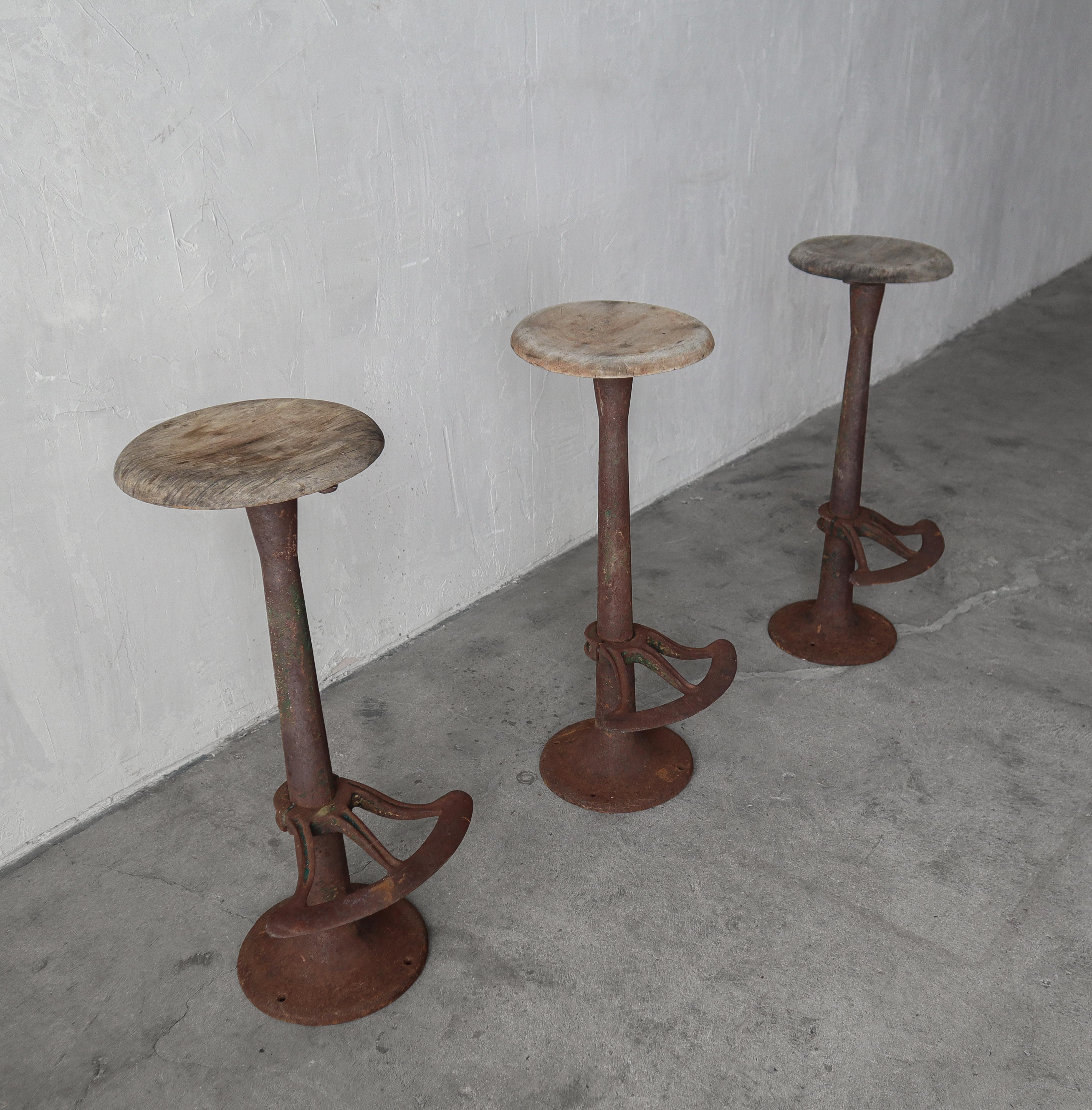 Set of 3 Antique Industrial Swivel Barstools In Fair Condition For Sale In Las Vegas, NV