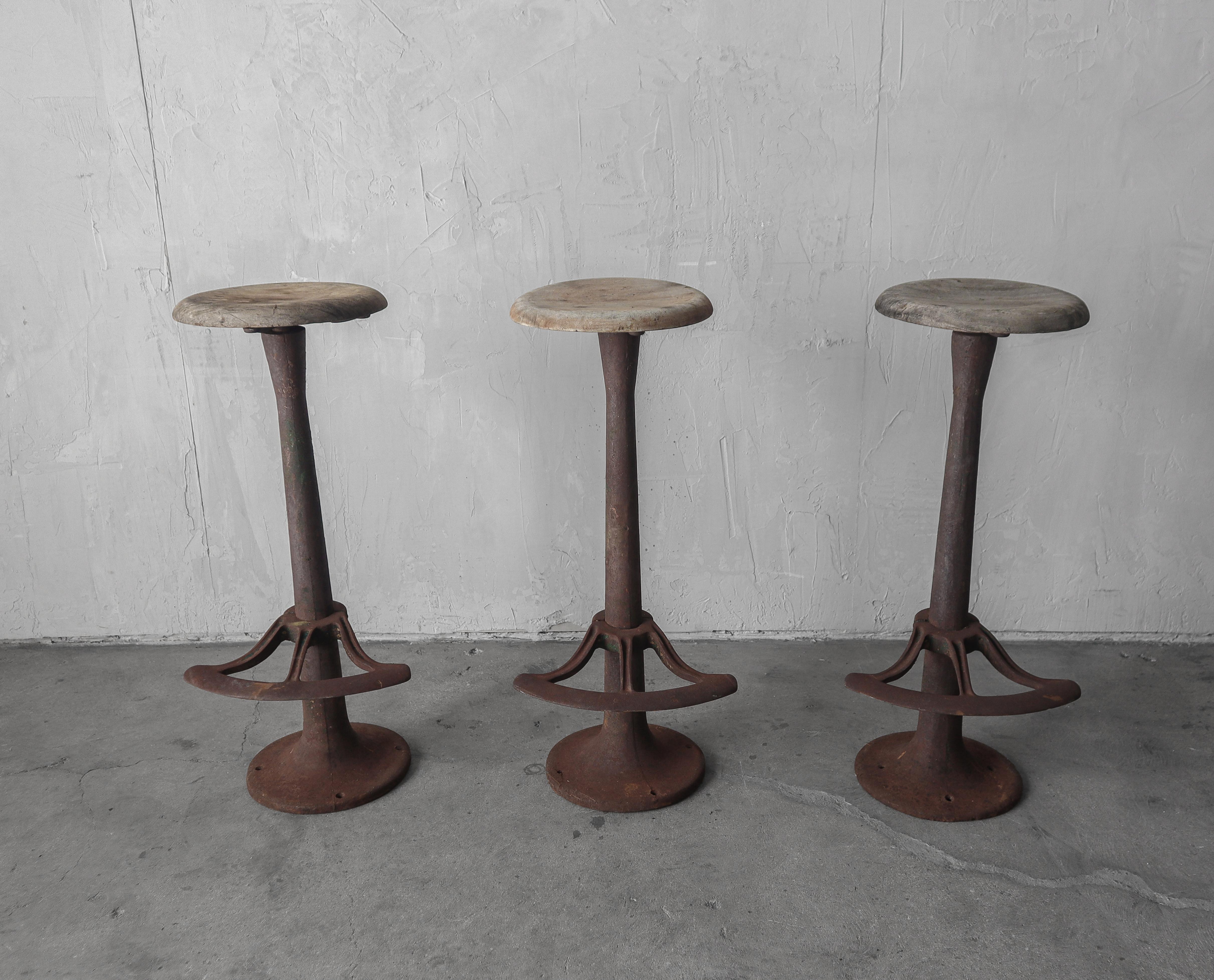 These stools were a barn find in Santa Barabara, California.  They have been made perfectly imperfect by time and the elements.  The handmade circular wood seats are weathered and the columns rusty, but solid, some of the original green paint still