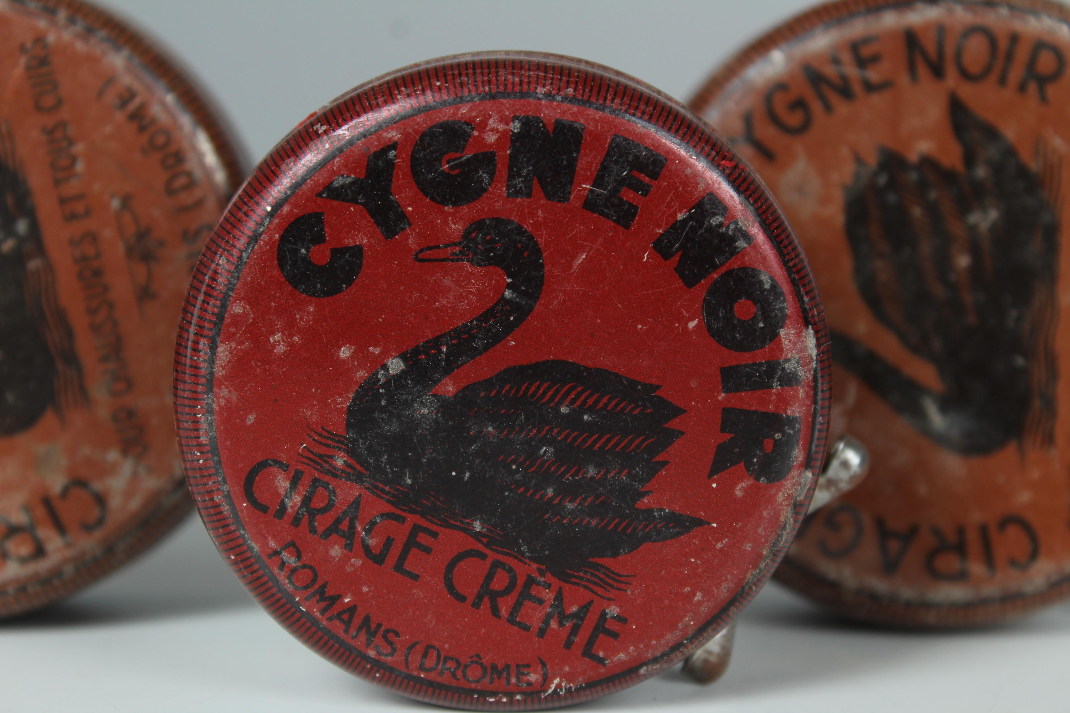 Set of 3 antique tin cans with shoe polish by Cygne noir.
