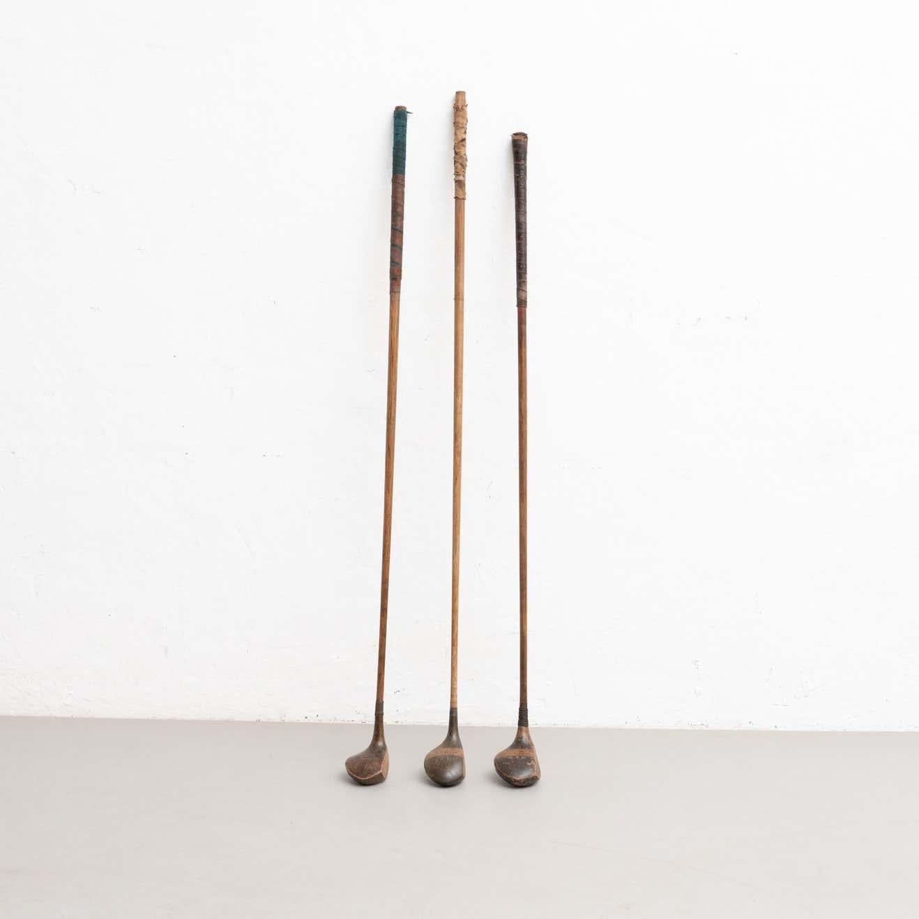 Set of three antique traditional Jack White's sports wooden golf clubs. 

Made in London, circa 1930.

In original condition, with minor wear consistent with age and use, preserving a beautiful patina.

Material:
Wood.
Metal.