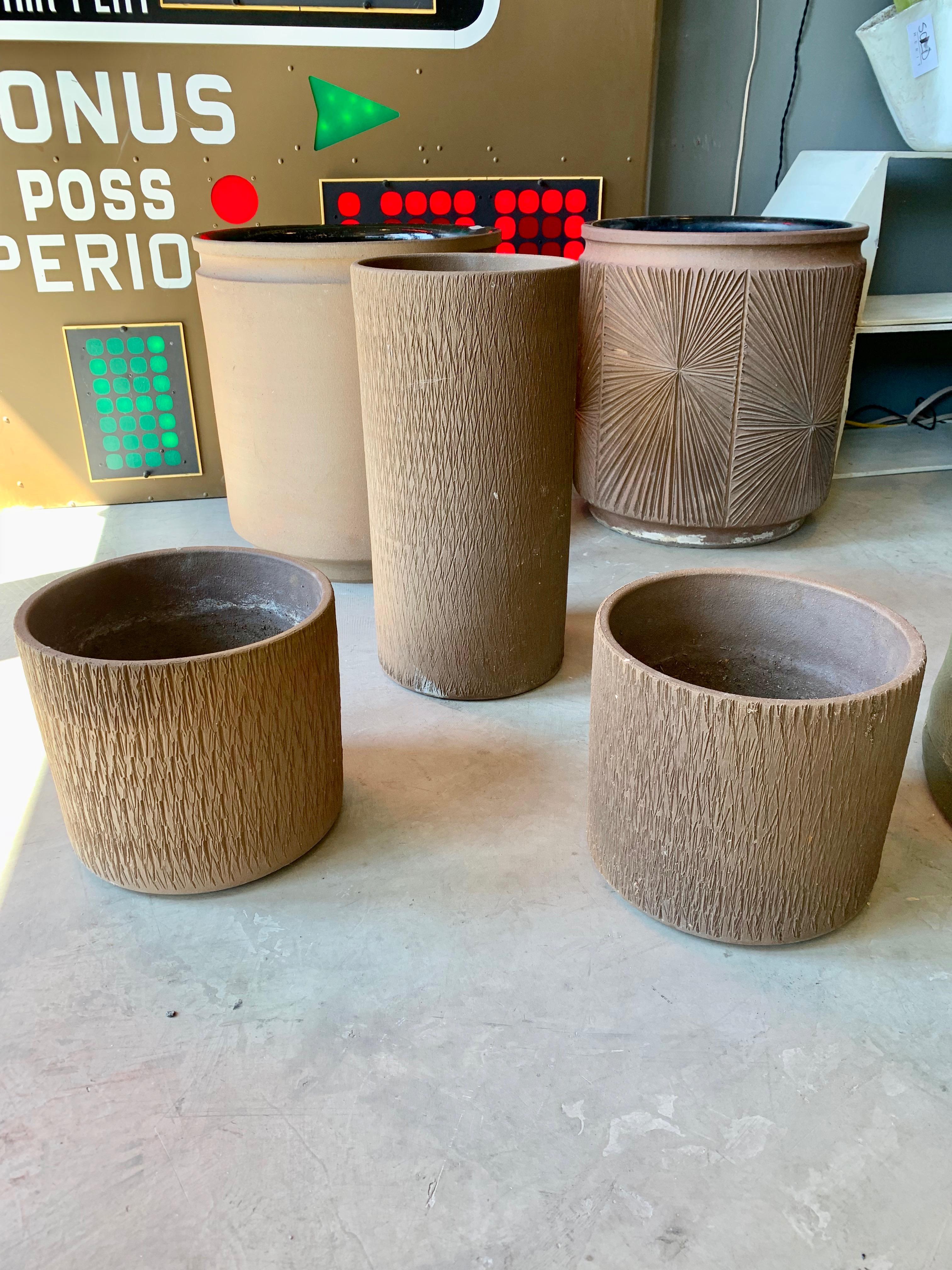 Gorgeous set of 3 Architectural Pottery planters by Gainey Ceramics. All three labeled underneath. 2 matching smaller planters and one tall planter. Great etched design. Good vintage condition with normal wear. Sold as a set of 3. 
Measures:
Small