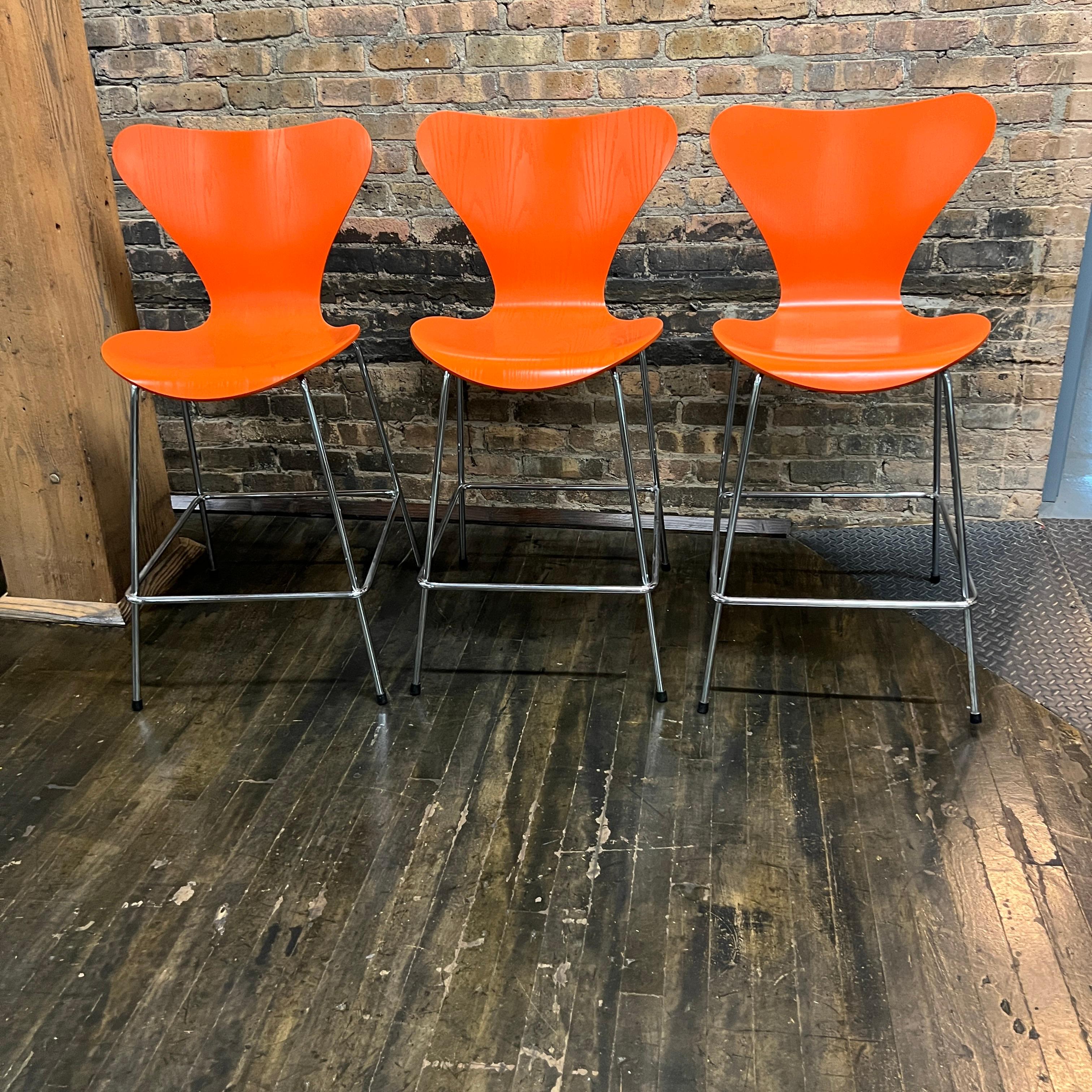 Mid-Century Modern Set of 3 Arne Jacobsen for Fritz Hansen Series 7 Counter Stools in Orange
