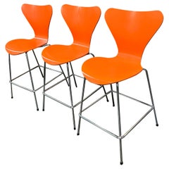 Set of 3 Arne Jacobsen for Fritz Hansen Series 7 Counter Stools in Orange