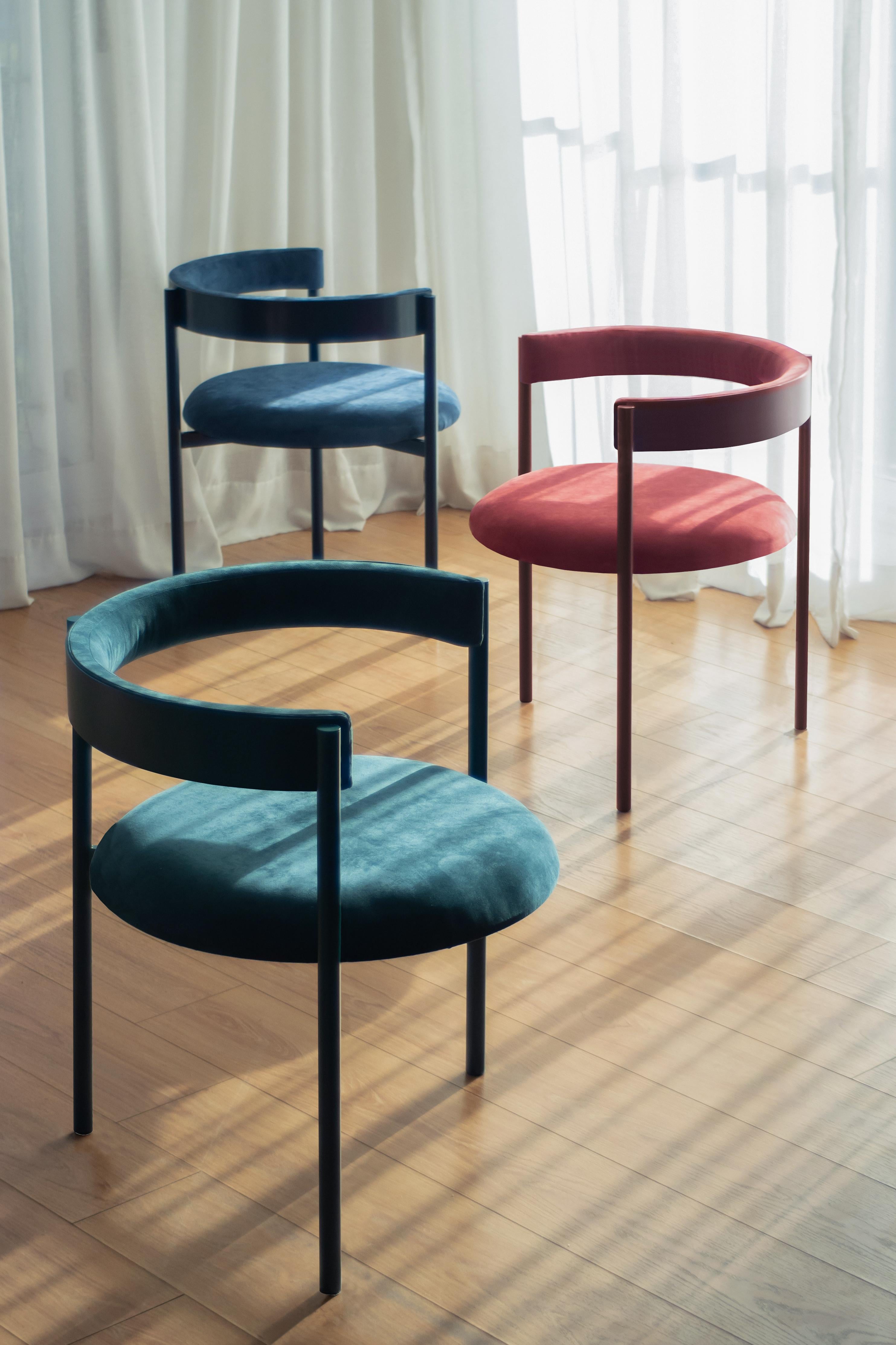 Set of 3 Aro chairs (Oceano, Merlot & Dark Blue) by Ries
Dimensions: W60 x D60 x H67,5 cm
Materials: round steel tube, high-density foam, and velvet upholstery

Also available: mika, pink and yellow.

Ries is a design studio based in Buenos