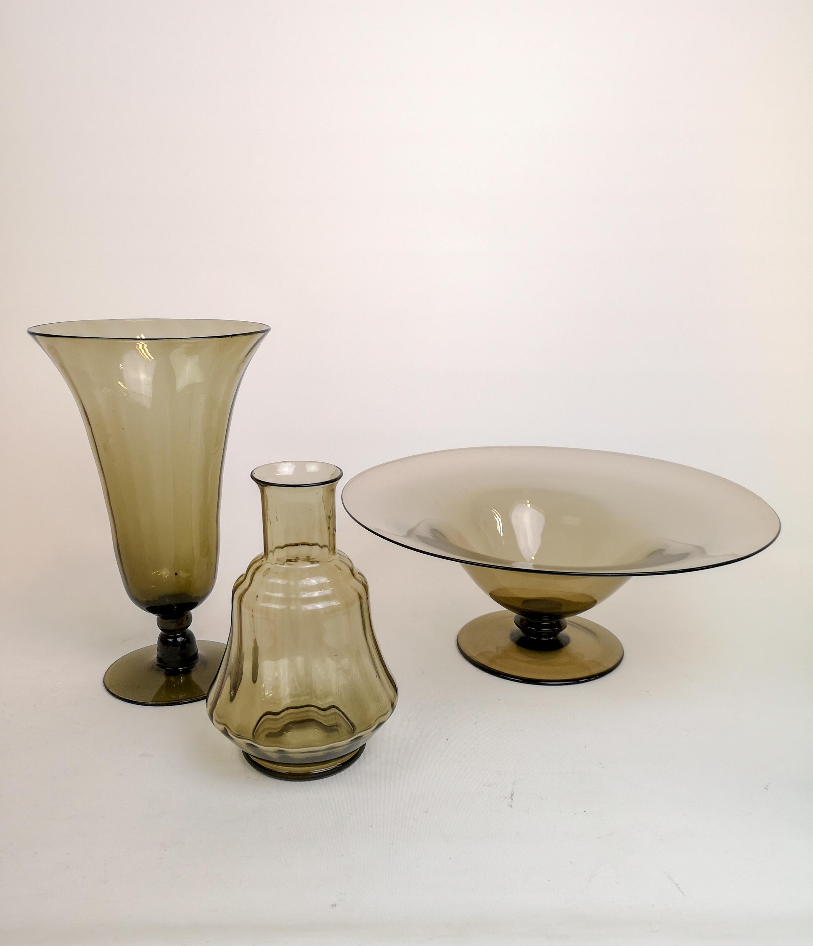 This pieces where made at Orrefors Sandvik and designed by Simon Gate in the 1920s-1930s Sweden.
The have light brown tone in the glass. Wonderful shapes and lines. 

Good vintage condition. 

Measures: Large vase H 26 cm, D 15 cm, small vase H