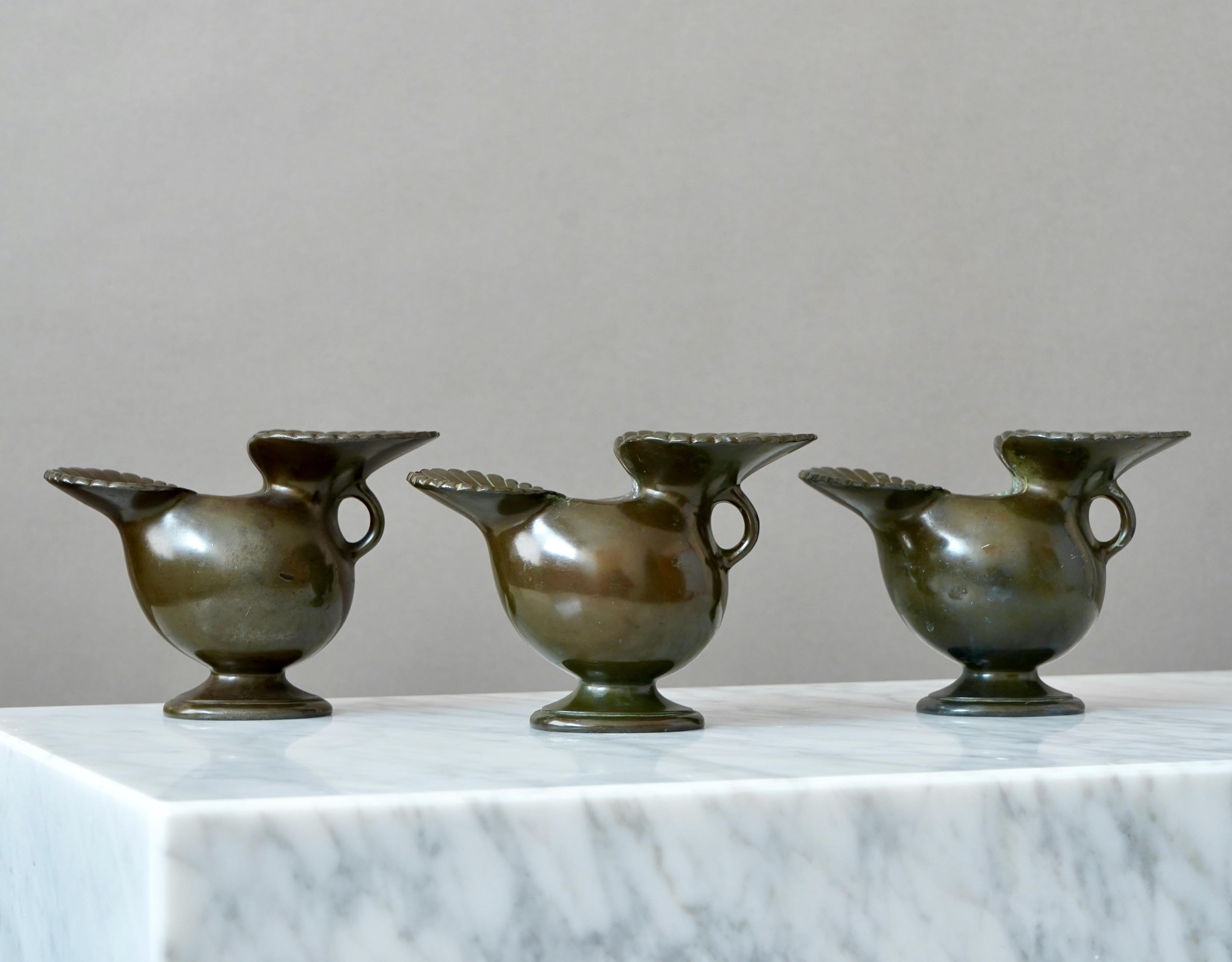 A set of 3 beautiful art deco vases designed by Just Andersen in 1930s and produced by his own company in Denmark. Made from Disko metal (an alloy of different metals invented by Just Andersen).

Fair condition. A lot of scuffs and