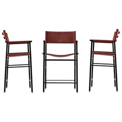 Set di 3 sgabelli da banco Artisan con schienale in pelle cognac, metallo nero e gomma