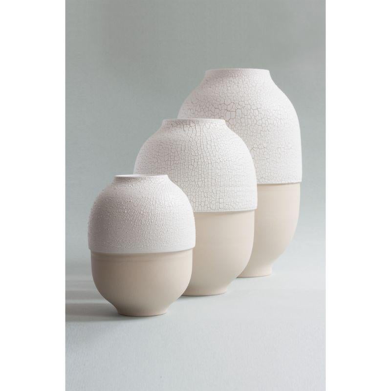 Set of three Atacama vases by Josefina Munoz
Dimensions: H35 X Ø25 x (L), H25 x Ø20 (M), H20 x D14 cm
Material: ceramic

This project is the result of the experimentation with a particular composition of glaze that cracks when fired, revealing a