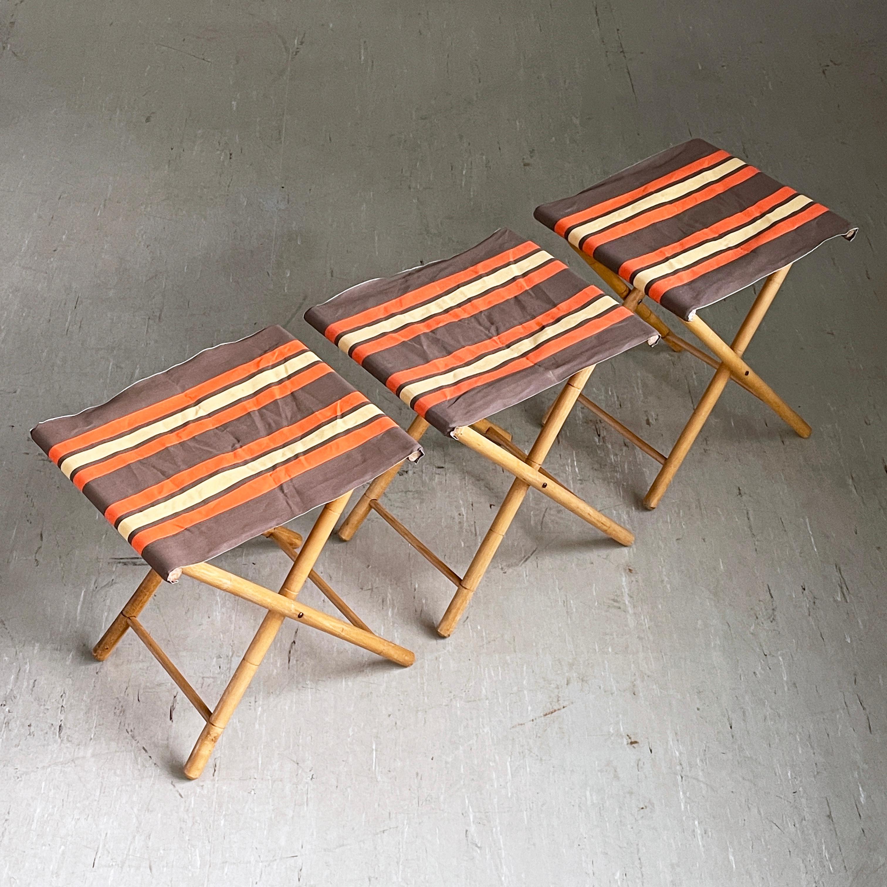 Set of 3 vintage 1960's Bamboo Camping Stools. Bamboo folding base with new seat strapping using original late 1960's / early 1970's heavy cotton material. 
Good, stable structure and ideal for multiple uses such as camping, fishing, concerts,