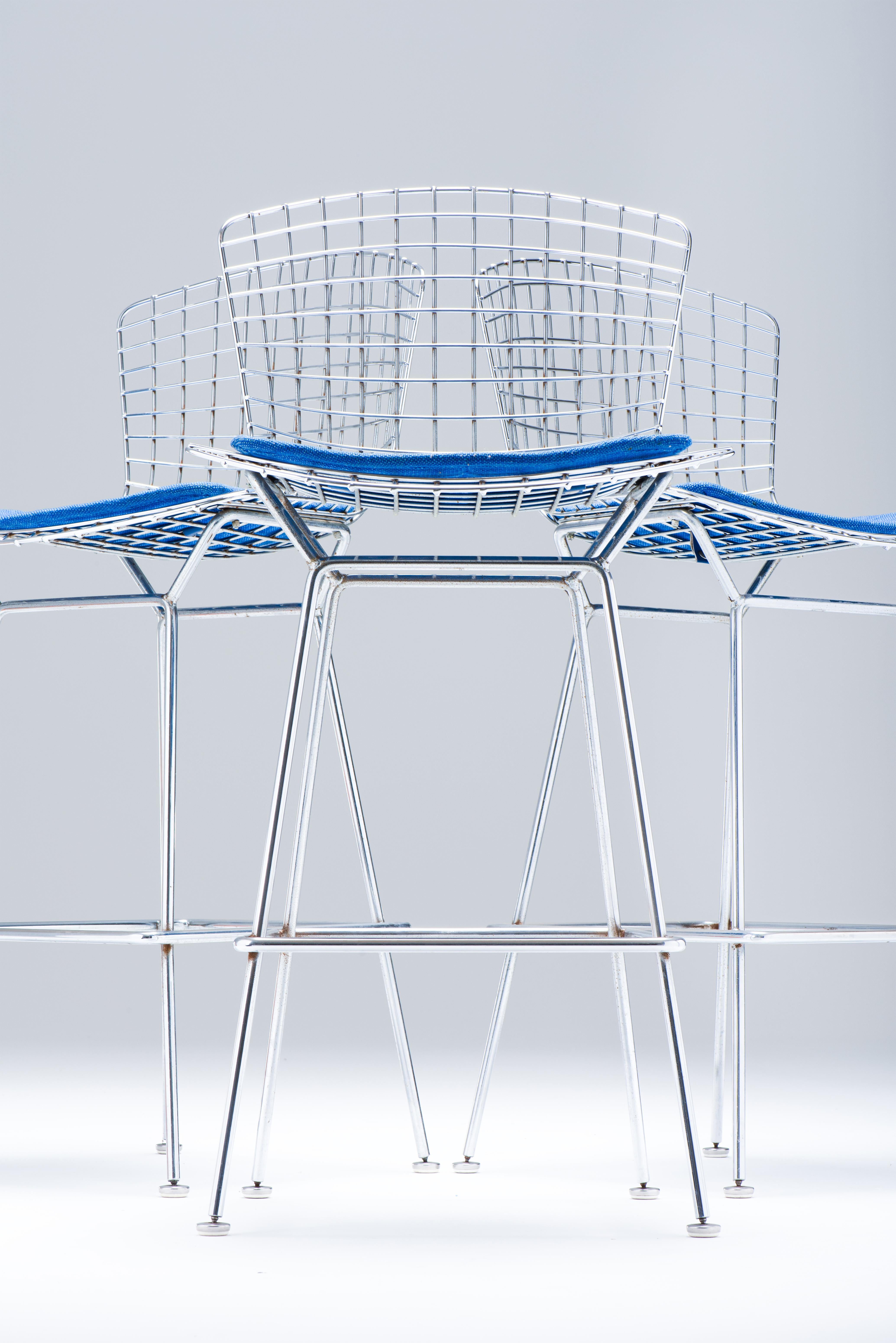 Vintage metal wire bar stools designed by Harry Bertoia. The Bertoia Barstool is part of Harry Bertoia's iconic 1952 wire collection. An astounding study in space, form and function by one of the master sculptors (kinetic) of the last century. This