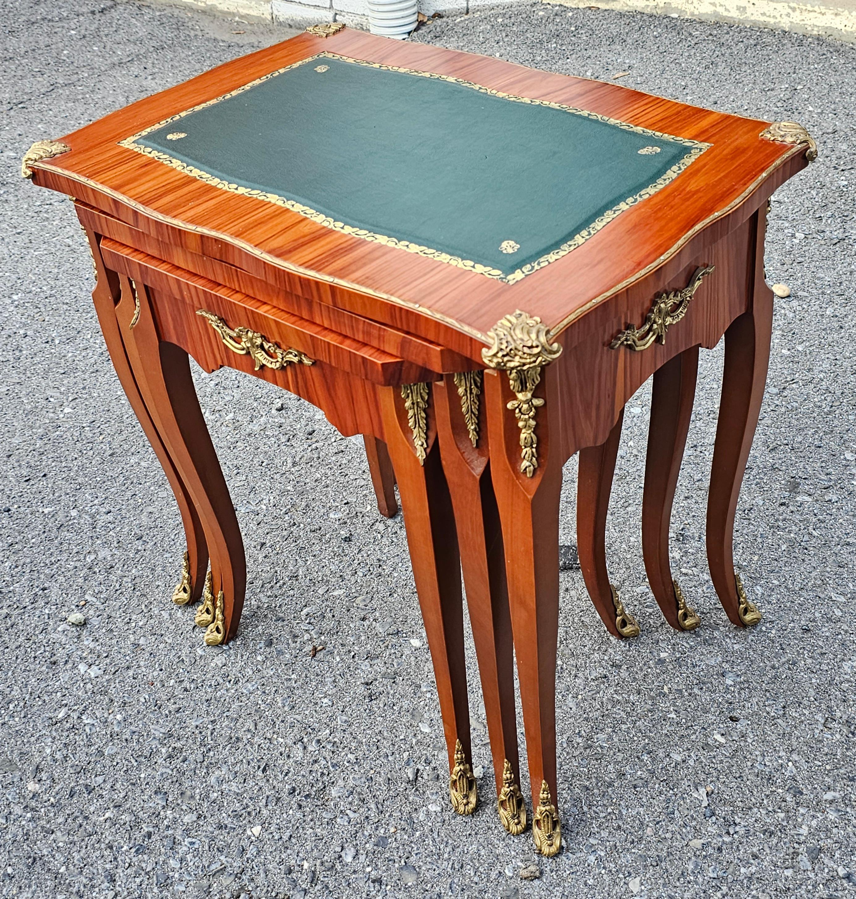 A Stunning Set of 3 Binda Collection Italian Louis XV Ormolu Mounted and Leather Inset Nesting Tables in great vintage condition.
Measures:
22.25