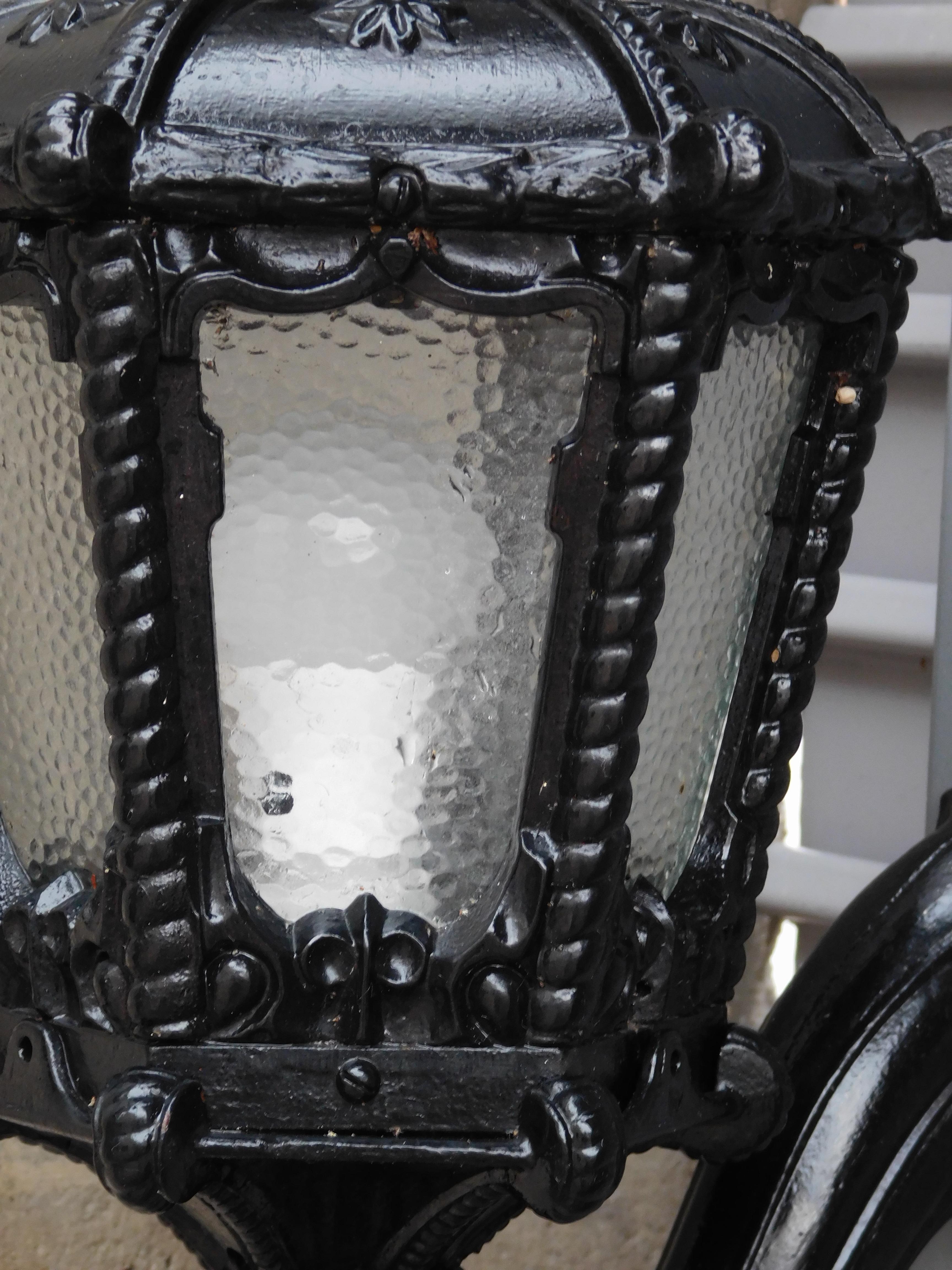 Set of 3 Black Iron Wall-Mounted Lantern Sconces In Excellent Condition For Sale In Chicago, IL