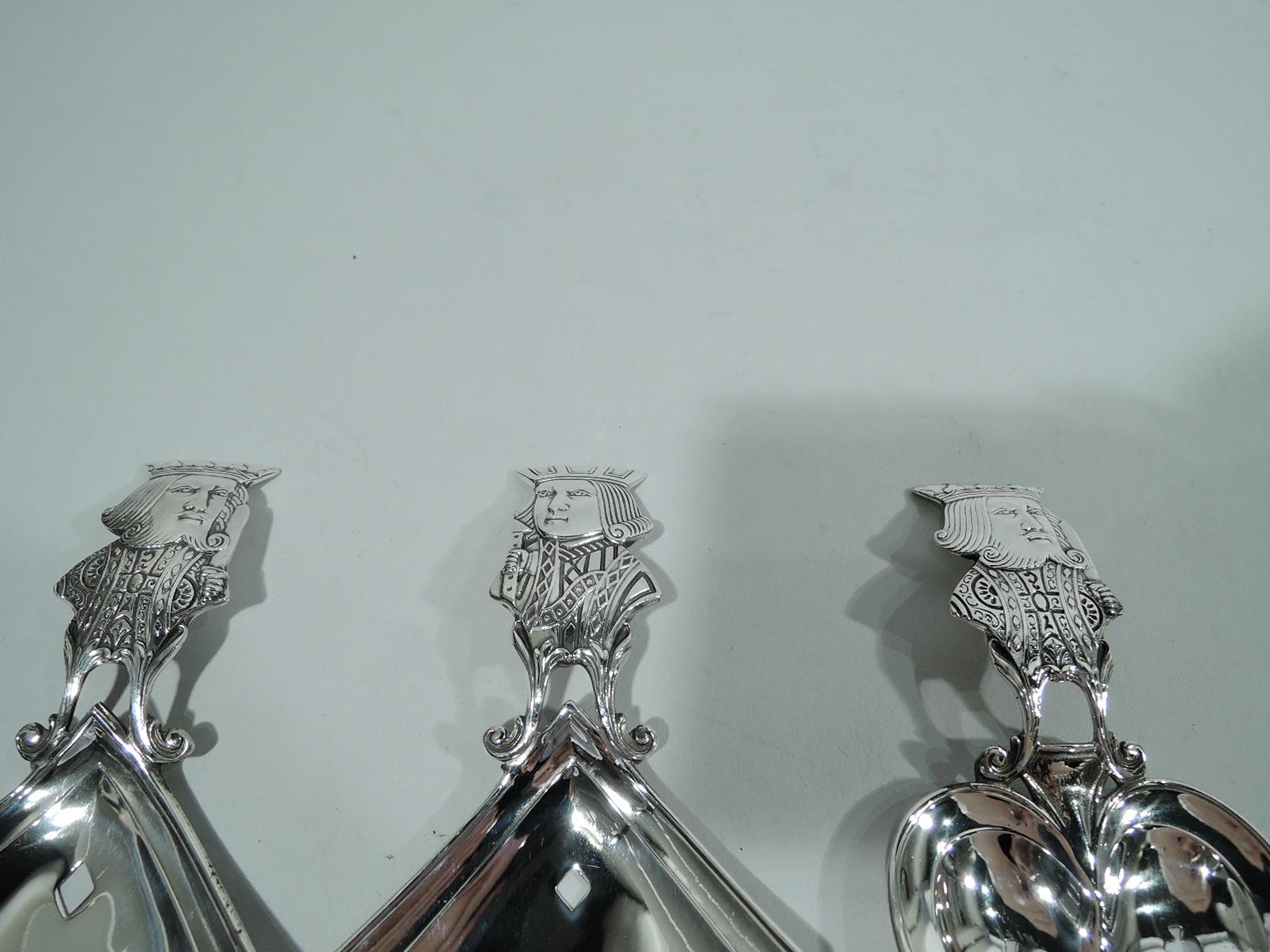 Set of 3 sterling silver bonbon scoops with playing card motif. Made by R. Blackinton & Co. in North Attleboro, ca 1910. This set comprises a king of hearts, a king of diamonds, and a jack of diamonds. Figural handles and suit-shaped bowls. A great