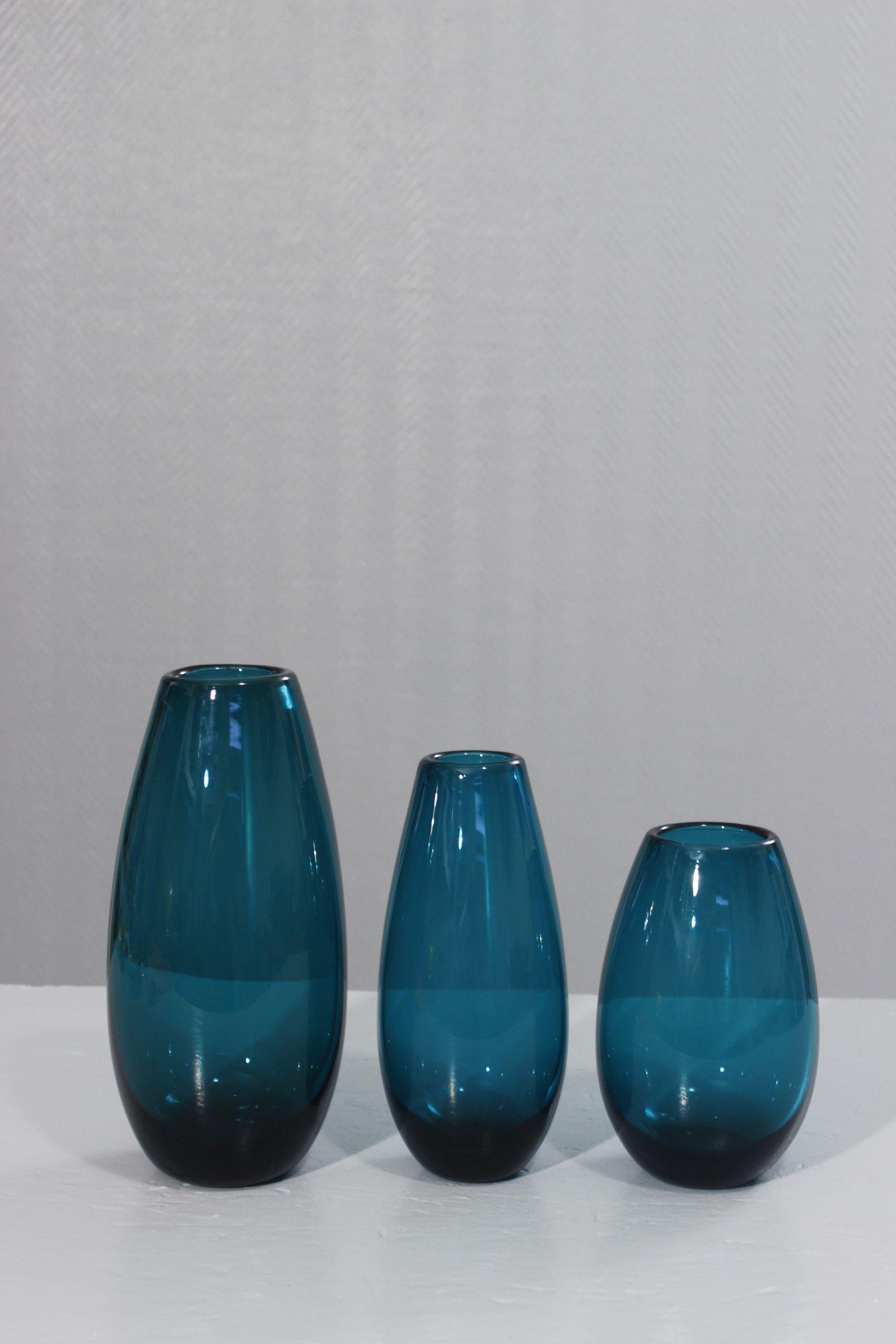 Set of three blown glass vases by Karl Friedrich Kristall Glas, Germany circa 1960. 

All in good condition, two small scratches. 

Dimensions:


1: Height 23 cm / Max. diameter: 10.5 cm
2: Height: 19 cm / Max. diameter: 8.5 cm
3: Height: 16 cm /