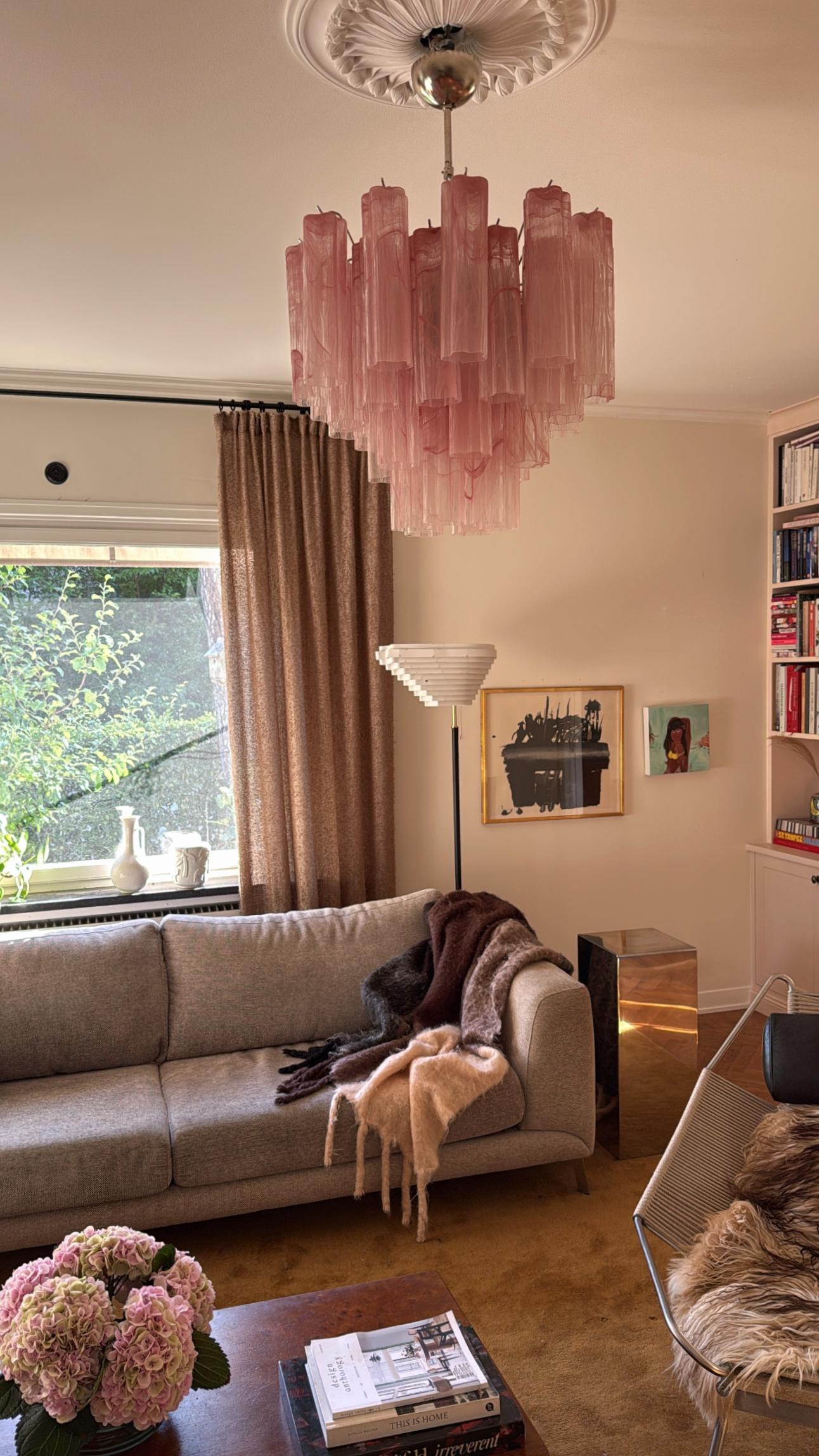 Set of three Elegant, Bold Pink Murano Chandeliers. Tubular Tronchi Formed Glass Prisms in pink tones with a swirled marble pattern. Traditional Italian Mid-Century Style.
The murano fixtures is composed of 36 Glass Elements in the size of 25 x7 cm