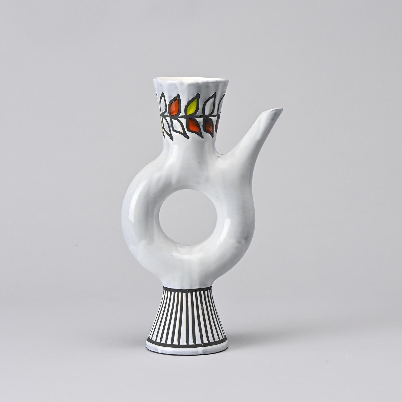 Set of three ceramic bottles by the acclaimed French ceramist Roger Capron, a key figure in the ceramic movement in Vallauris from the 1950s onward.

A hallmark of Capron's artistry, these polychrome enamel ceramic bottles feature striking geometric