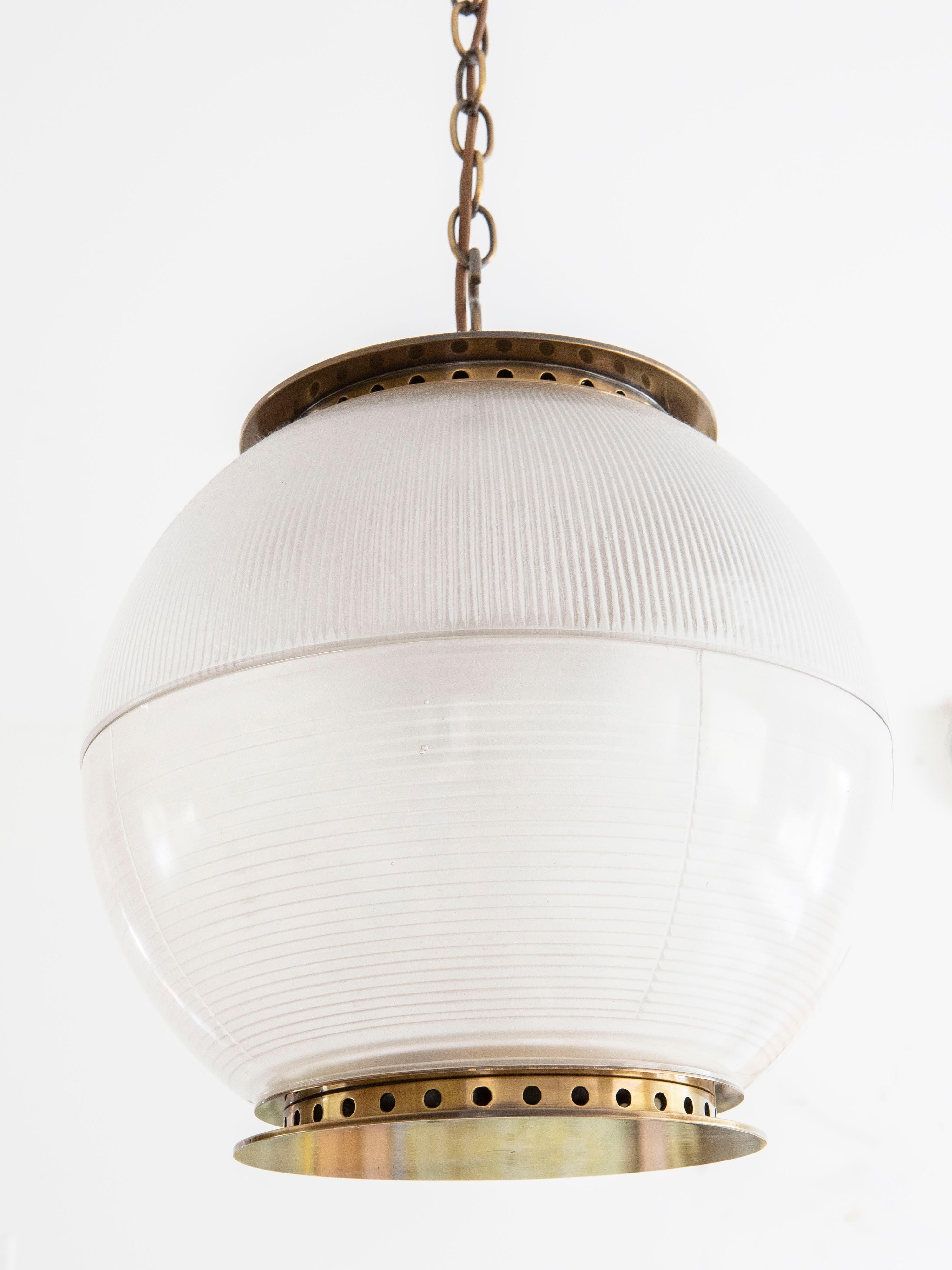 Feanor's Globe brass and opaque glass pendant by Hector Finch. The prismatic glass helps disguise low-energy / LED bulbs. Ideal for kitchens, halls and landings. Wired for USA. Lamping: 3 sockets, 40W max per socket. 38