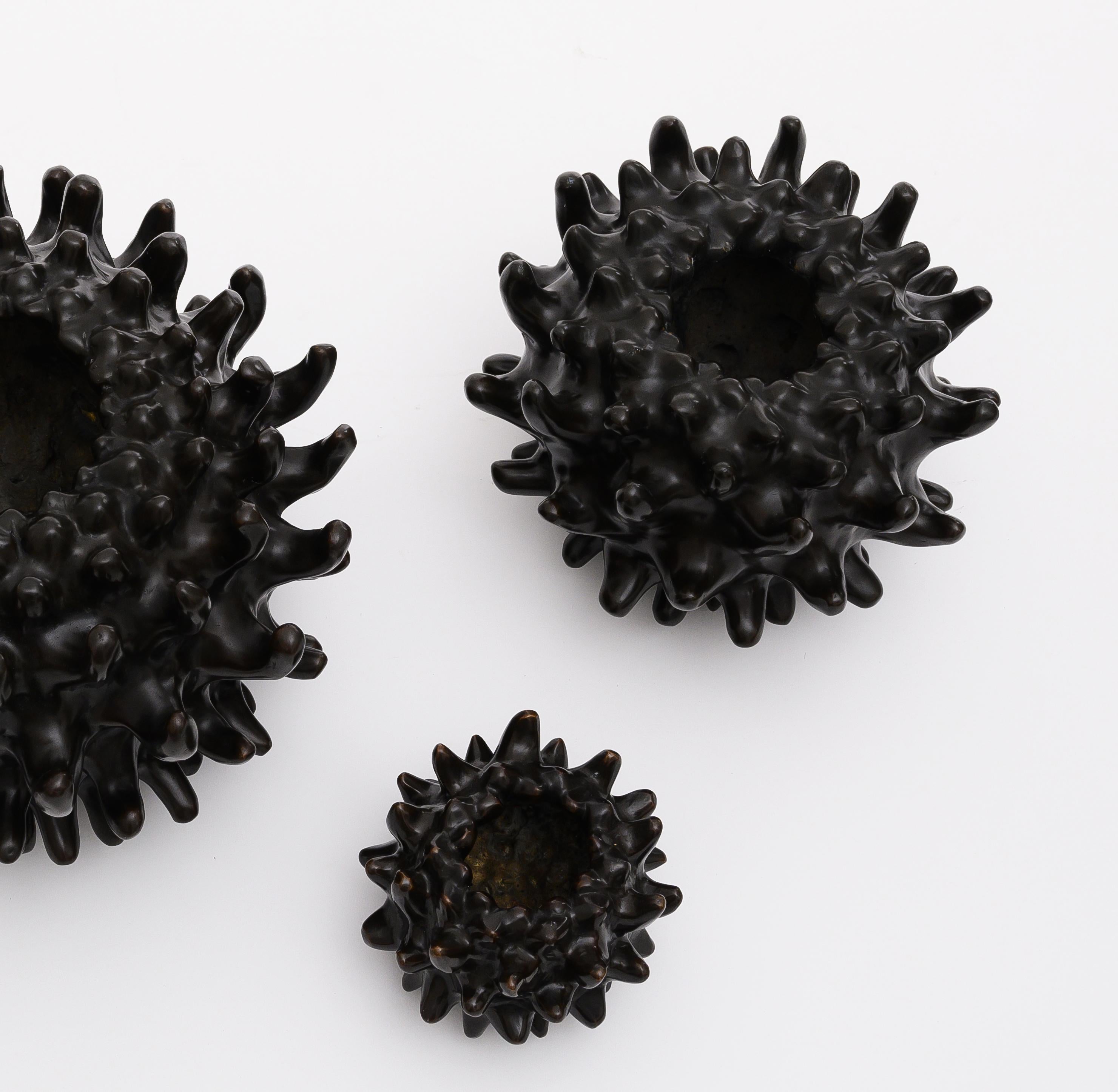 Set of 3 bronze uni vase and sculpture by Elan Atelier.

Uni vase is made in our atelier by hand utilizing the lost wax casting technique. The vase was inspired by a sea urchin and mimics the profile of the deep-sea creature.

The Uni collection