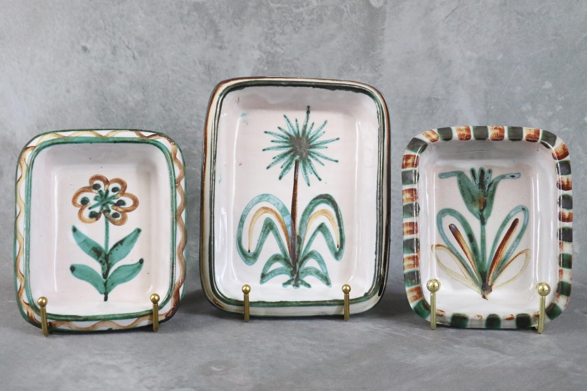 Set of 3 ceramic dishes by Robert Picault, Vallauris, French Ceramic, 1950's

Handmade, they are enameled in green, brown and white colors and are decorated with geometrical and flowers patterns. 
They are in good condition and all are signed.

The