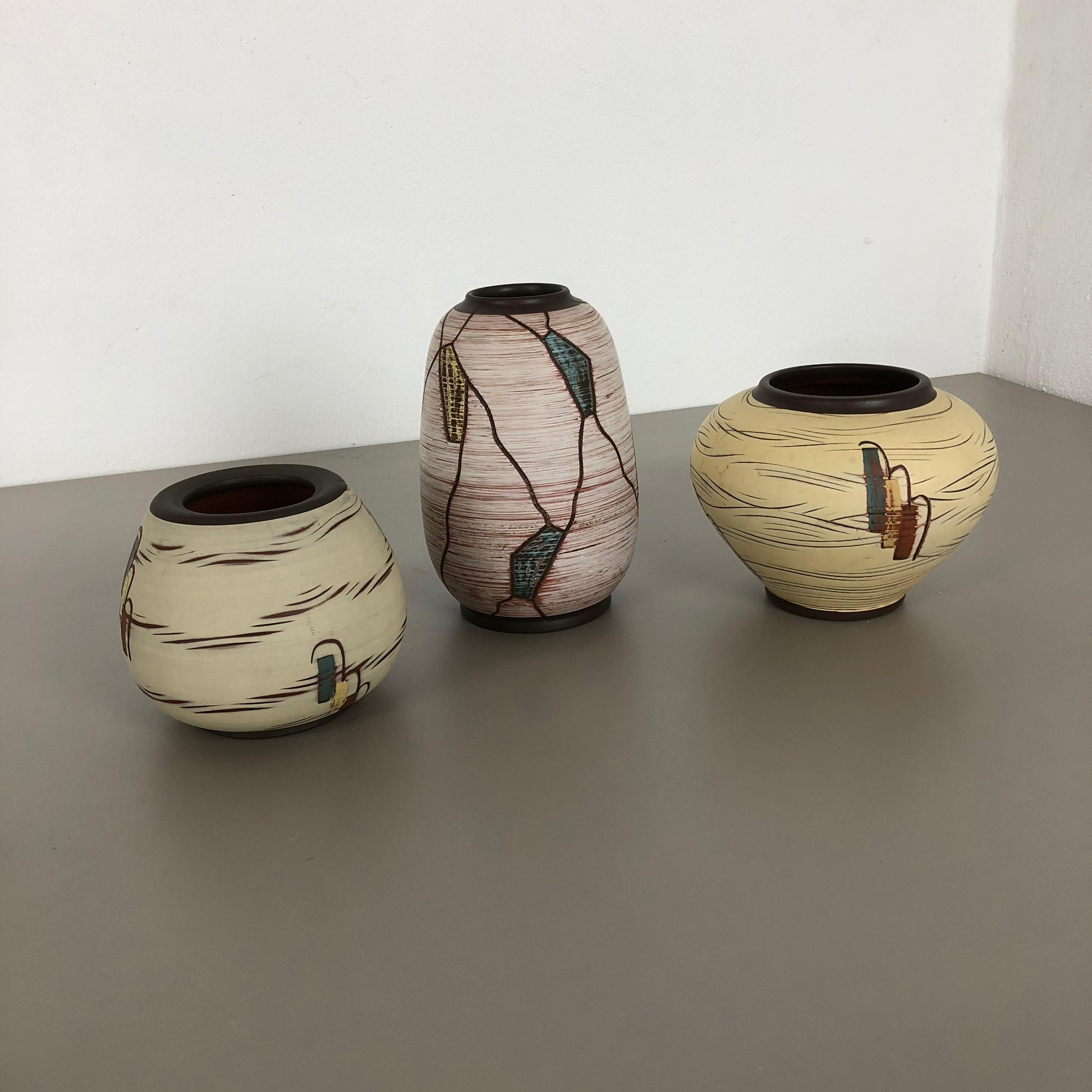 Article: 

Pottery ceramic vases set of 3


Producer: 

Sawa Ceramic, Germany


Design: 

Franz Schwaderlapp


Decade:

1960s


Description: 

Original vintage 1960s pottery ceramic vases set in Germany. High quality German