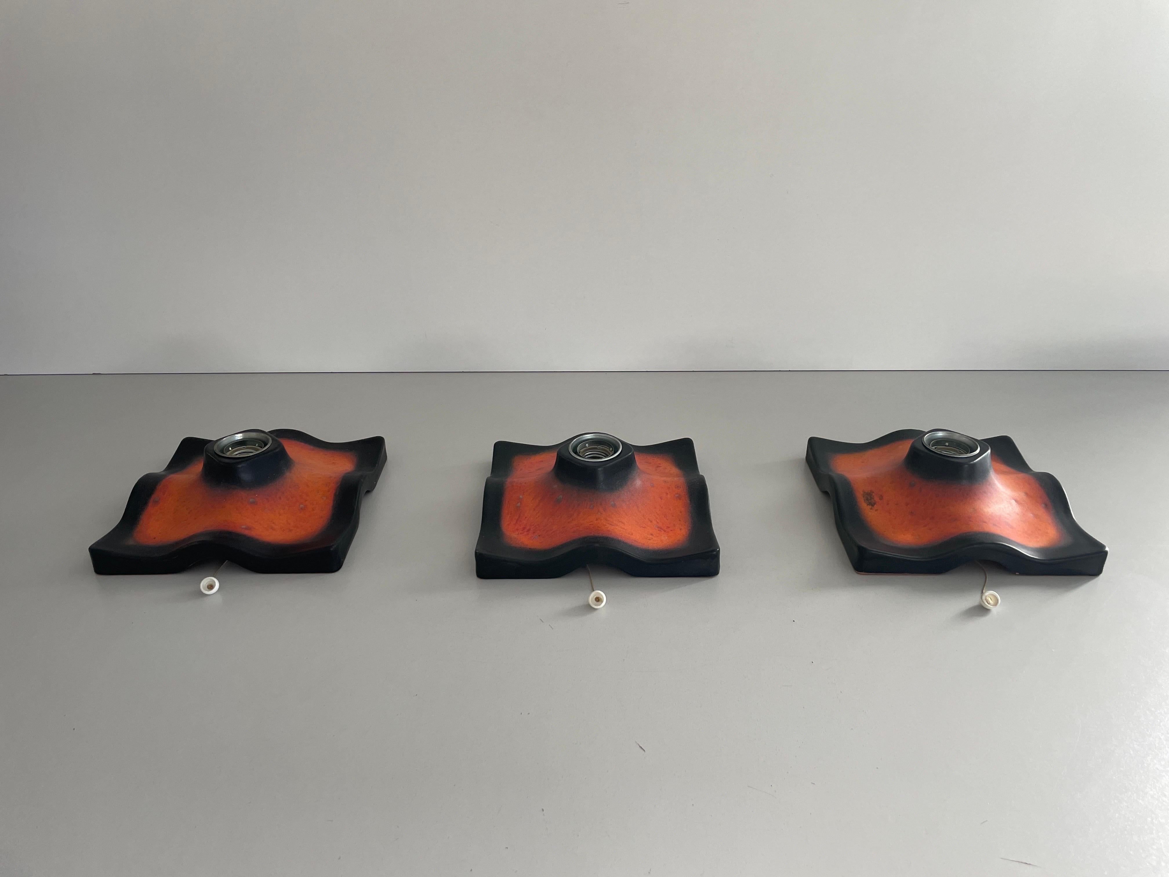 Set of 3 Ceramic Sconces by Pan-Leuchten, 1960s, Germany

Very nice high quality wall lamps.

Lamps are in very good vintage condition.

These lamps works with E14 standard light bulbs. 
Wired and suitable to use in all countries. (110-220