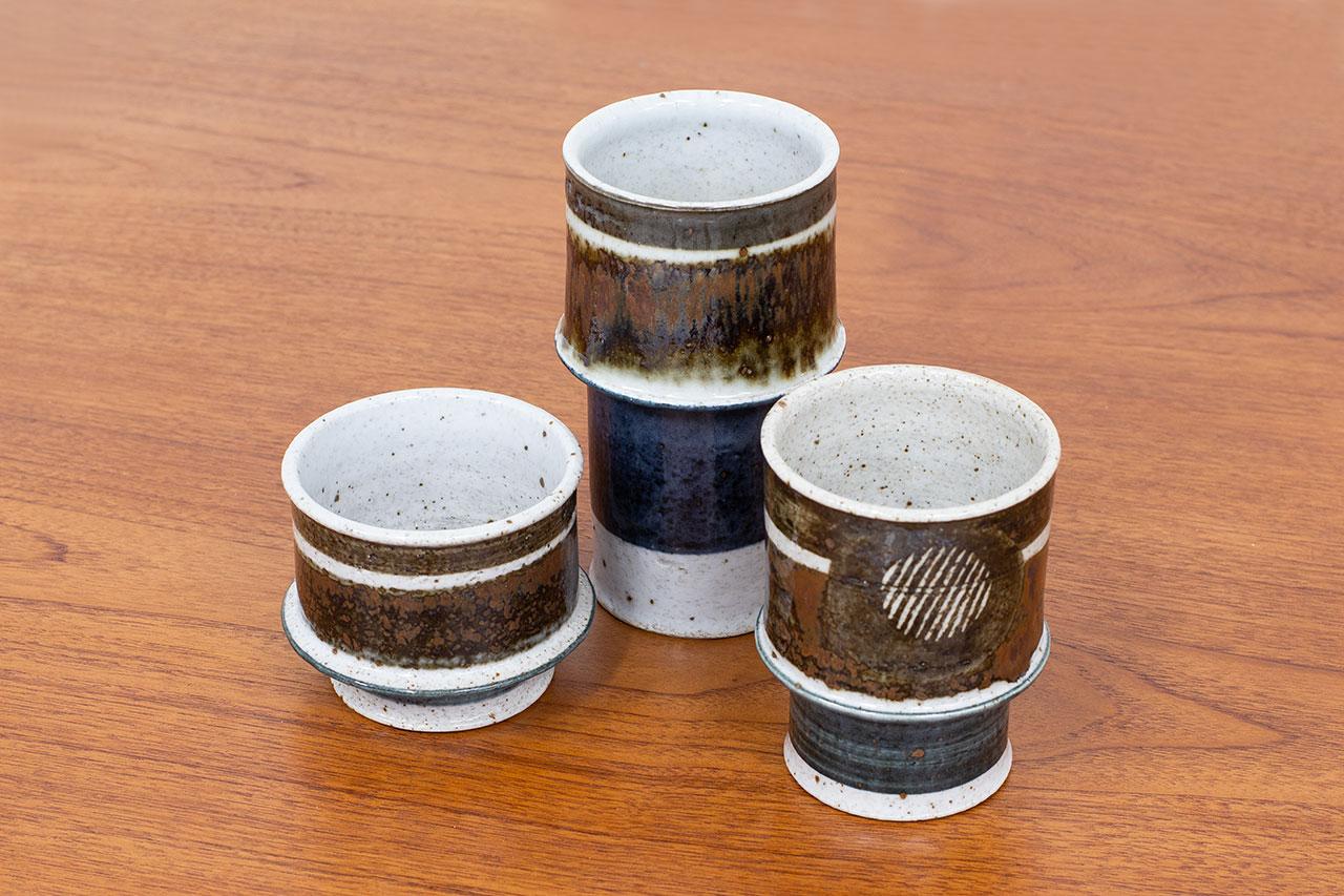 Group of 3 ceramic vases designed by Inger Persson and manufactured by Rörstrand in Sweden during  the  1960s. The jars are made from stoneware.
Glazed with an elegant graphic pattern with typical colors from the 1960s, shifting from grey, dark