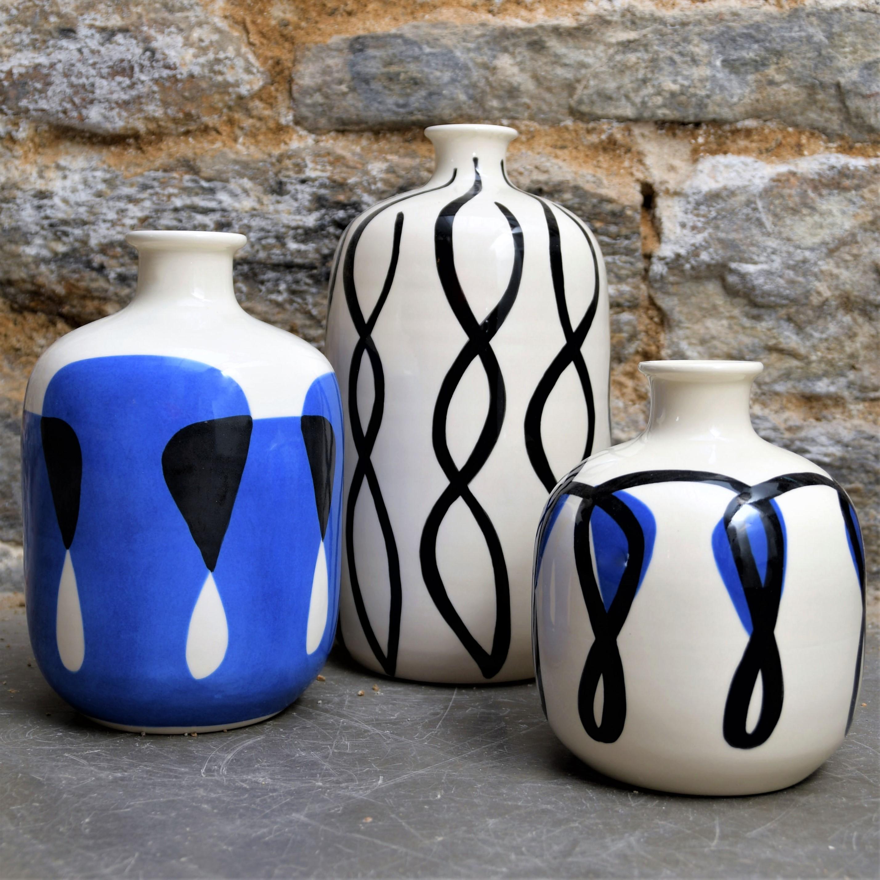 Set of 3 hand-turned ceramic vases by artist Valérie Le Roux. These pieces are hand painted and glazed, decorated with graphic nautical motifs : kelp and sea fronds in cobalt blue and black. This Minimalist design never goes out of style.

Valérie