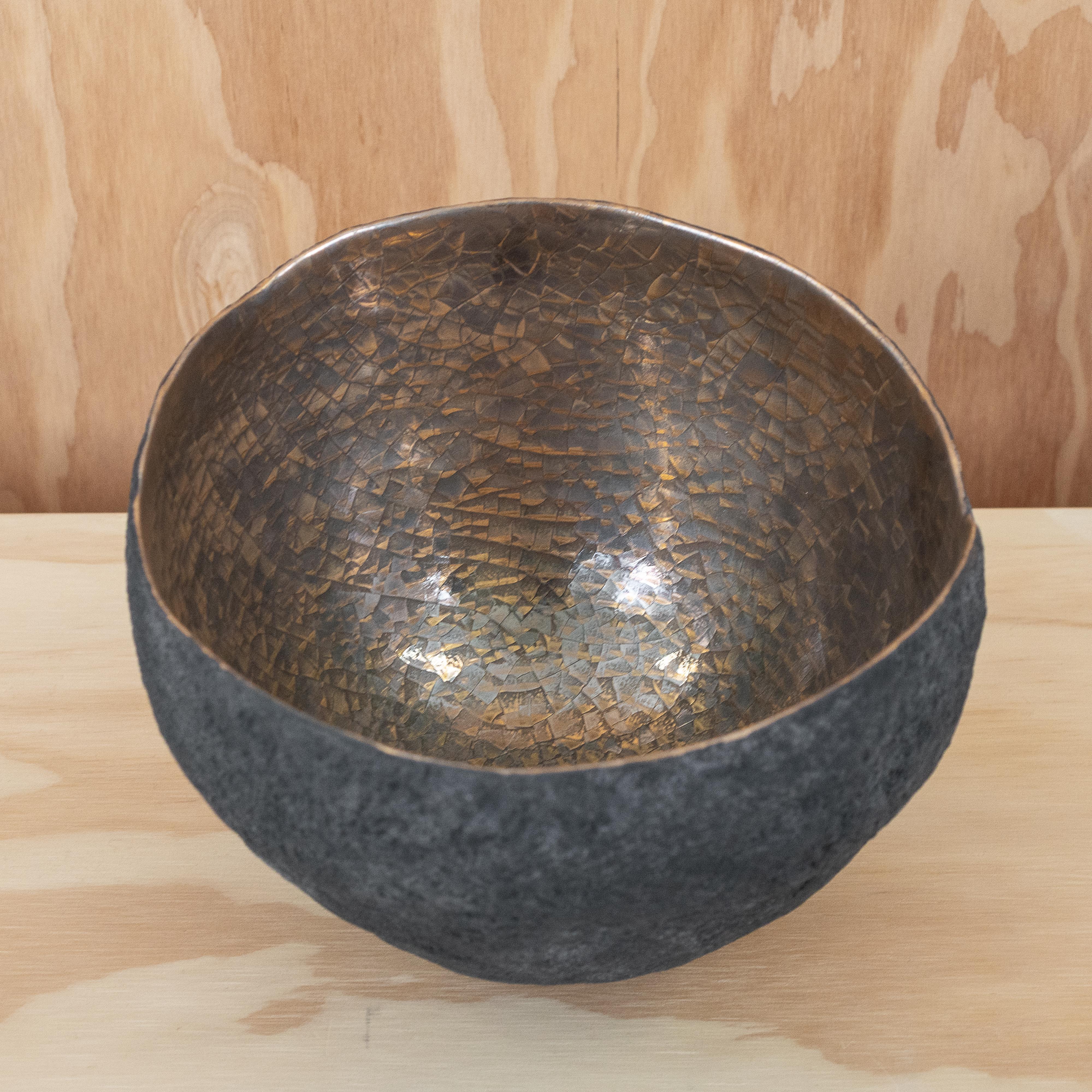 Set of 3 ceramics / centerpieces with gold and platinum interior.

Beginning with a ball of clay, Cristina Salusti pinches it into vessels and textures them with stone fragments. After multiple firing it is finally lustered with a mix of 22-karat