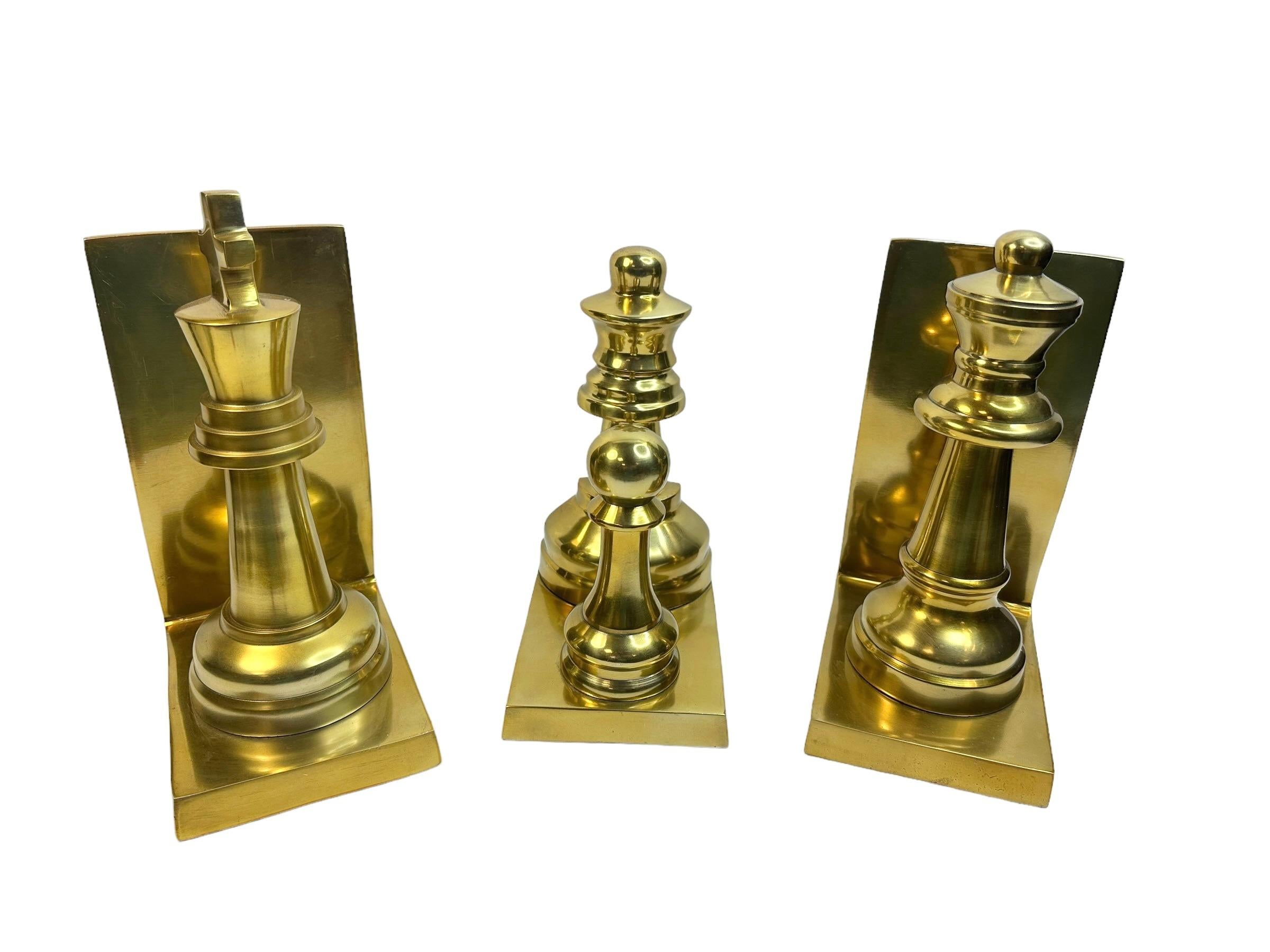 Channeling old world glamor into your home decor, this set of three brass finish bookends is both a useful and decorative addition to your home office, library, study or lounge. Found at an estate sale in Bologna Italy. 
The King bookend is approx.