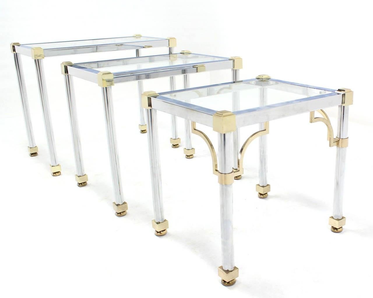 Set of 3  Chrome and Brass Metal Glass Top Nesting Side End Occasional Tables 
Table 1 = 21” h 25” 1/4” w X 15”d, Table 2 = 19” x 21 3/4” 15”, Table 3 = 17 3/4” x 18 1/4” x15” less