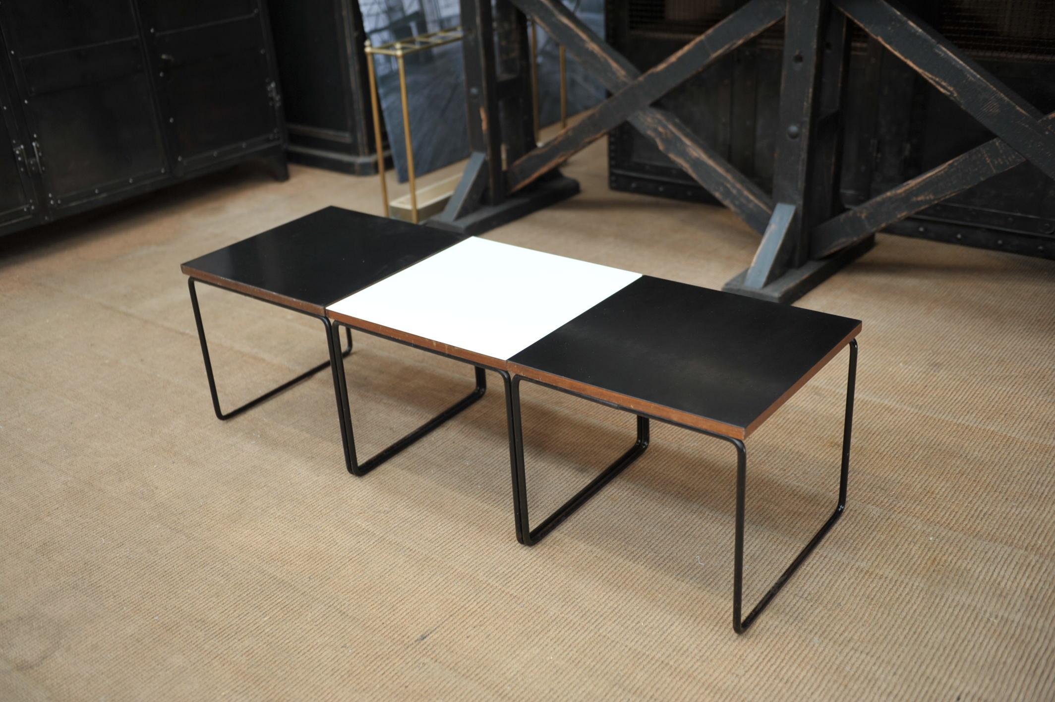 Set of 3 coffee table by French Designer Pierre Guariche for Manufacturer Steiner France circa 1950 Iron base and exotic wood top covered with black and white célamine .Stamped Steiner and each tables.
