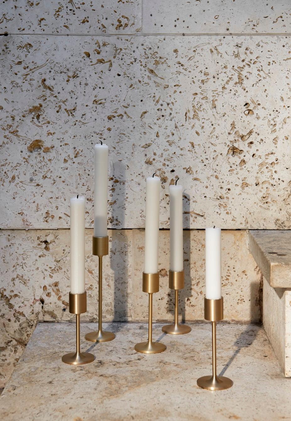 Inspired by the striking simplicity of Doric columns found in Ancient Greece, these gleaming brushed brass candleholders are a sculptural addition to the home. 
They sit within Collect, a curated line of beautifully crafted soft furnishings and