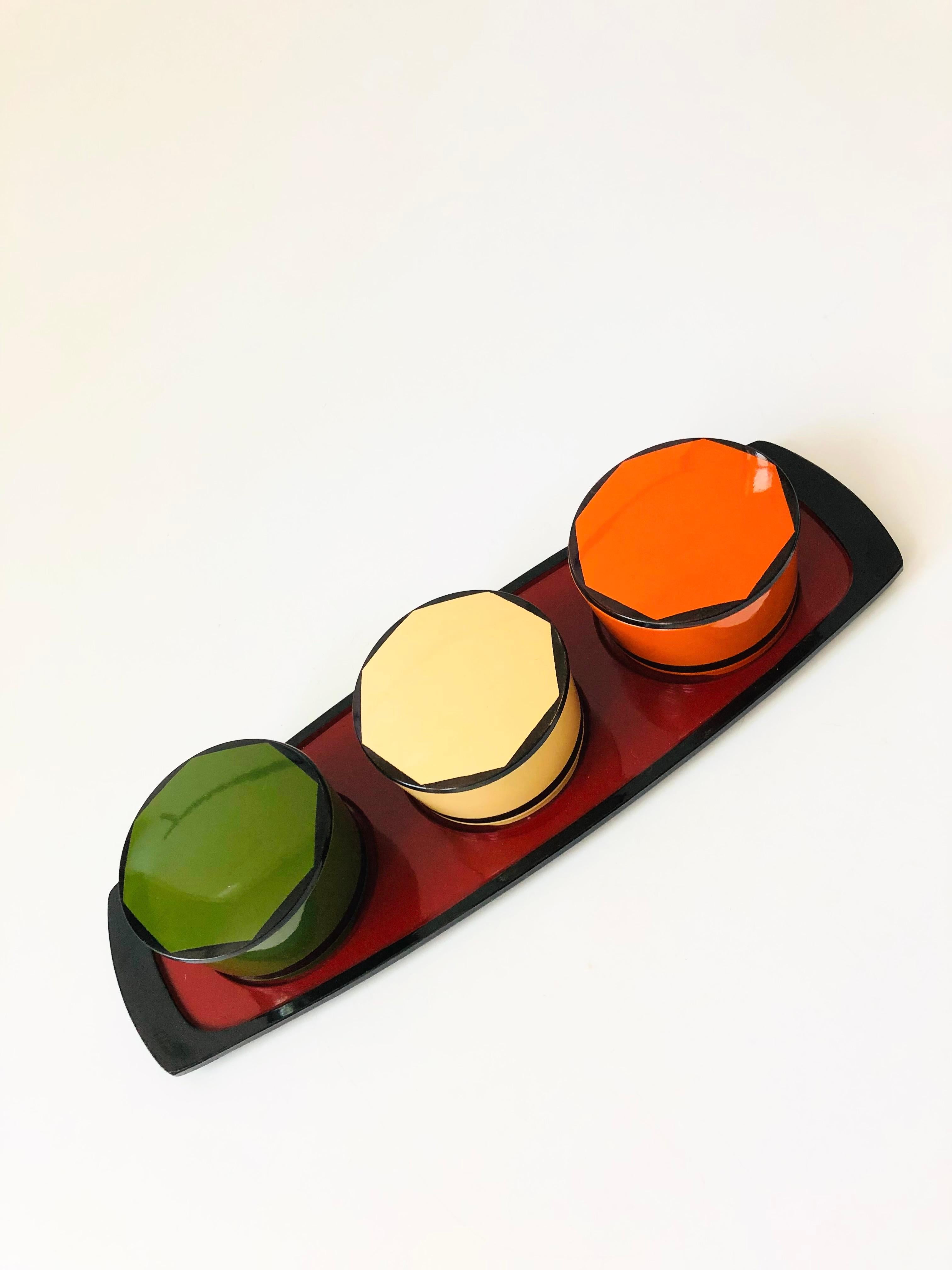 A set of 3 colorful vintage Japanese lacquerware boxes on a matching tray. Great for using as a desk organizer or for serving small dishes.
Measures 14.25