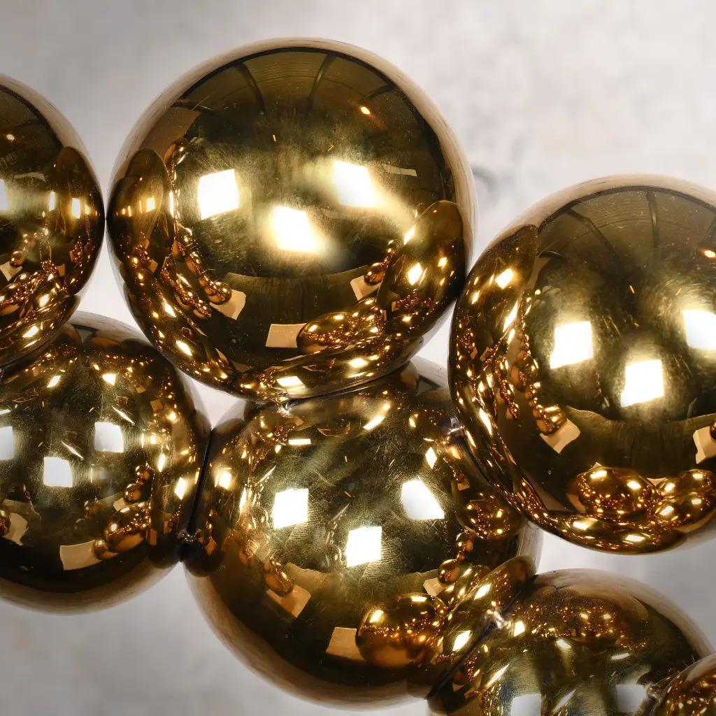 Hand-Crafted Set of 3 Contemporary Golden Bronze Bubble Sculptures on White Marble Bases For Sale