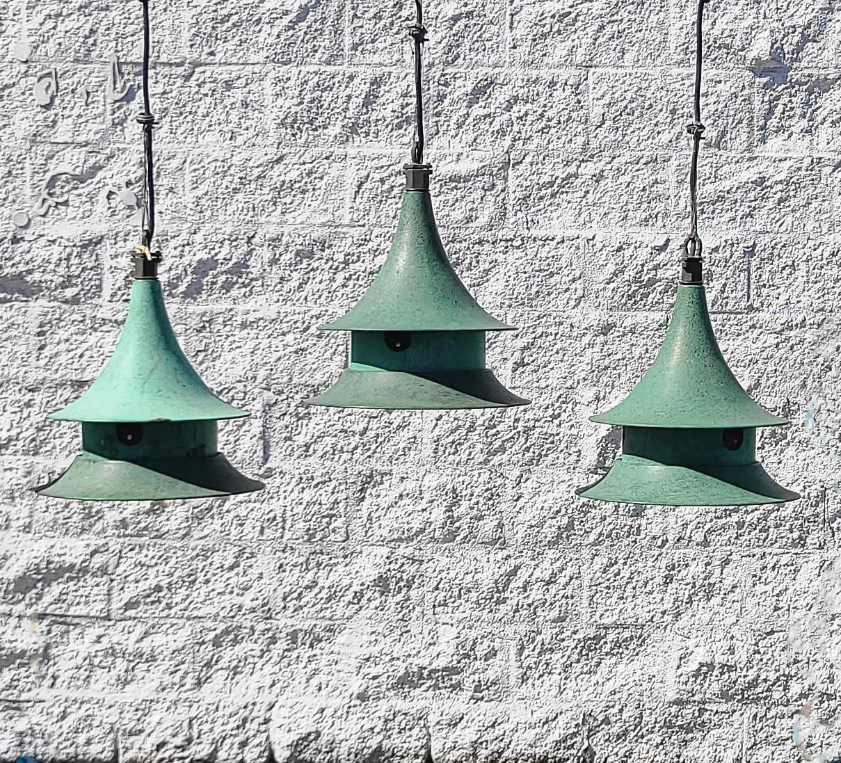 Nice set of Wren House suspension pendant lights in cast bronze & verdigris copper by Kim Lighting.  These pendants are a vintage model, they no longer manufacture the 12
