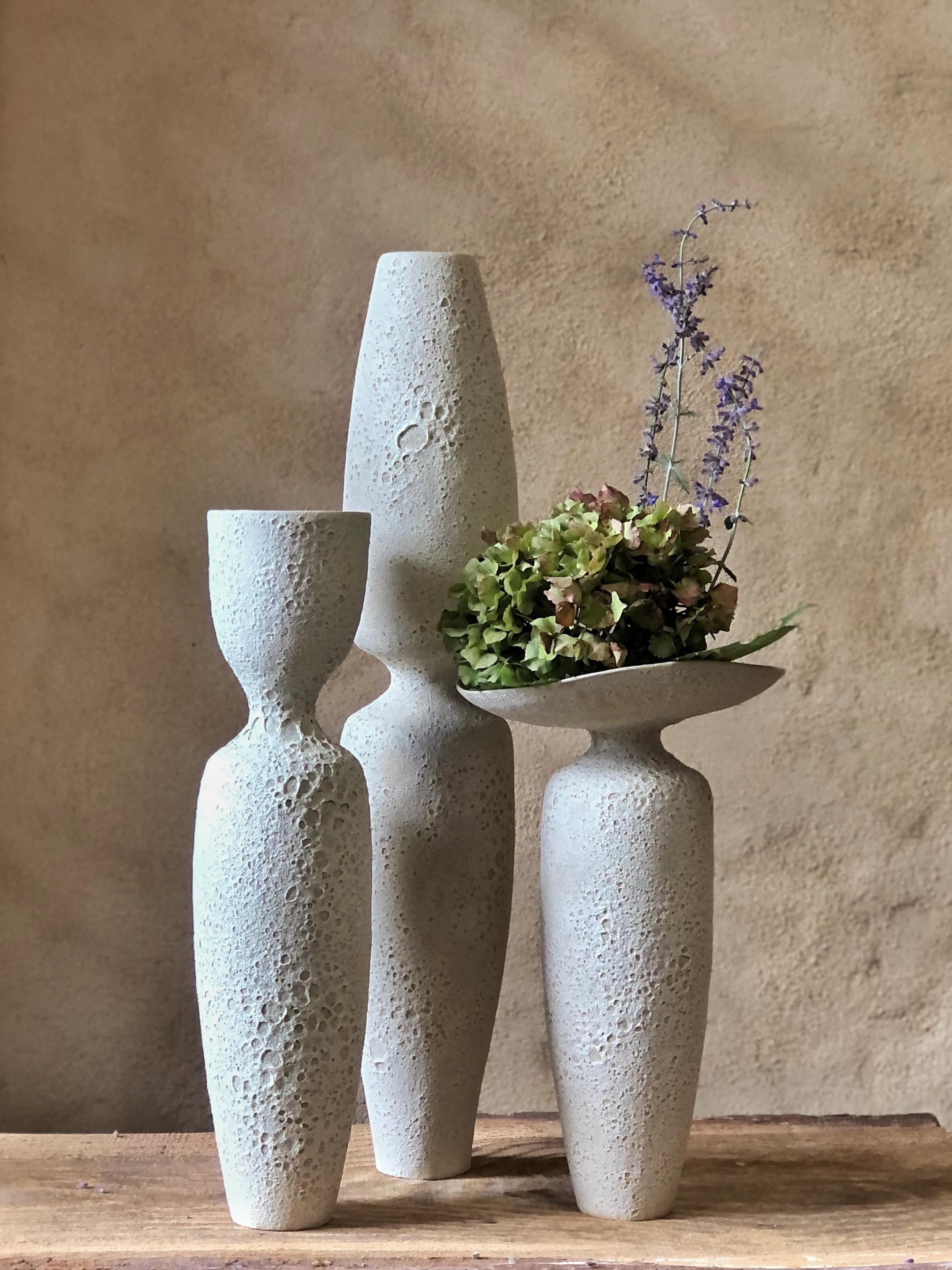 Set Of 3 Crater Vases by Sophie Vaidie
One Of A Kind.
Dimensions: High Crater Vase: Ø 11 x H 60 cm. 
Corolla Crater Vase: D 15,5 x W 21,5 x H 35 cm. 
Cup Crater Vase: Ø 10 x H 43 cm. 
Materials: Beige stoneware with crater glaze.

In the beginning,