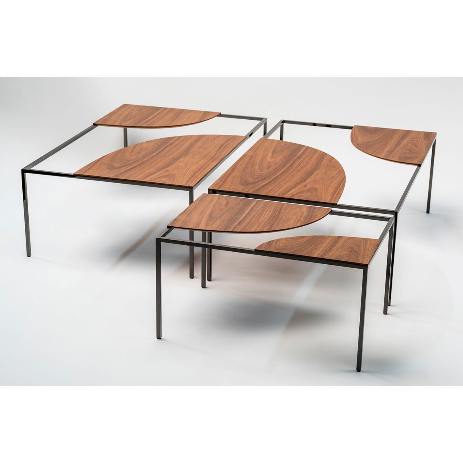 Set of 3 creek coffee table by Nendo
Materials: Top: solid wood (Also available in powder coated metal)
Structure: Black chrome metal
Dimensions: W 90 x D 60 x H 31.7 cm
W 60 x D 60 x H 31.7 cm

Creek is a table that suggests a stream of water