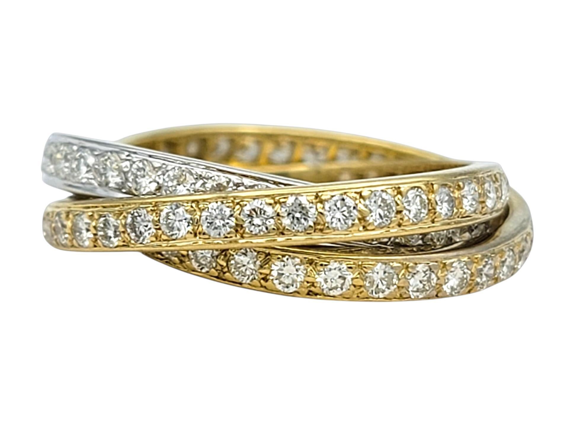 This elegant stackable ring set features three slim diamond bands designed to be worn together for a chic layered look. Each band is delicately lined with shimmering diamonds that create a continuous ribbon of sparkle across the finger. The mix of