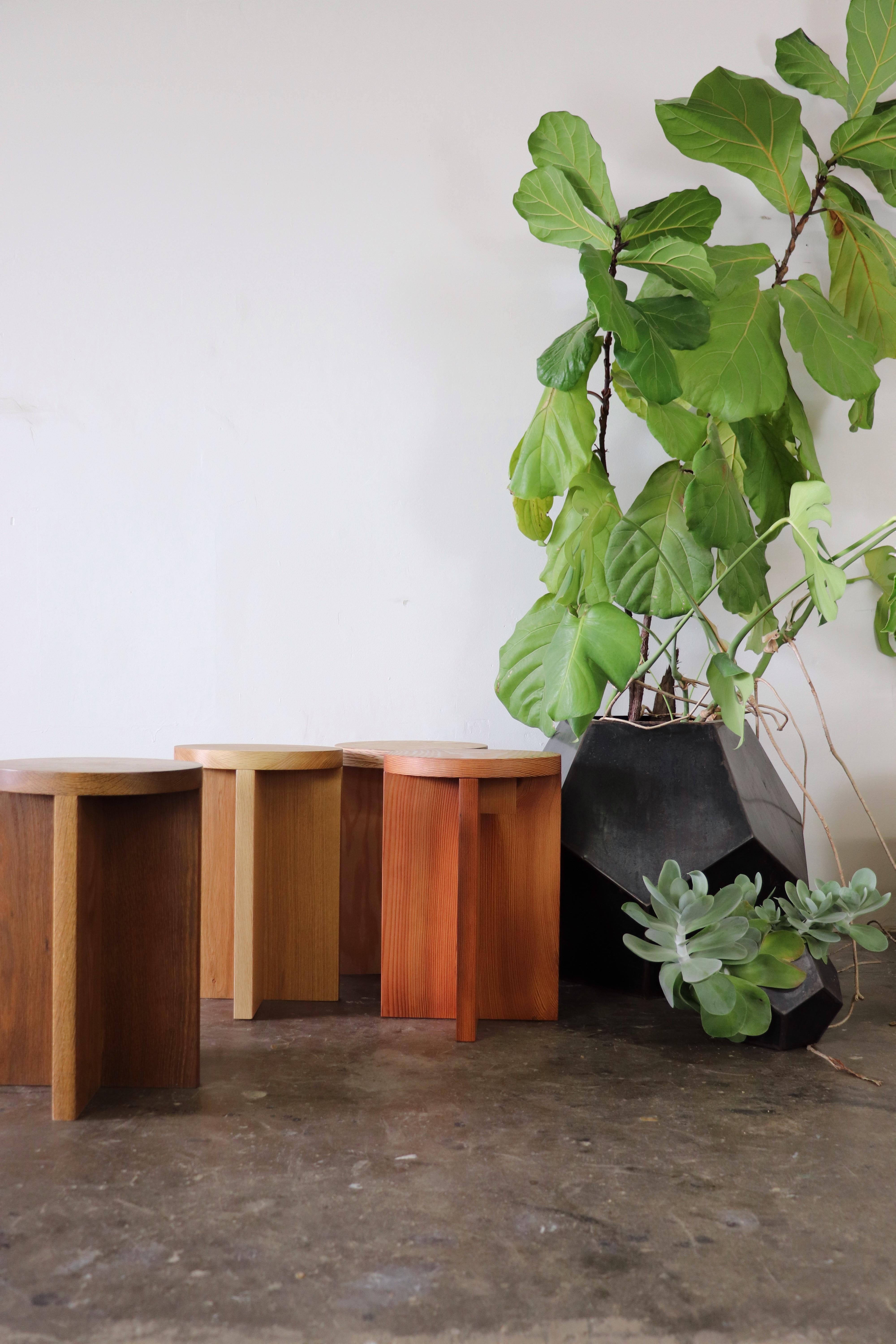 Solid wood stool / side table in fumed white oak with round top. The fuming process reacts with the tannins in the wood and results in a color through, rich amber tone. With a clean and minimal design, these stools are handmade in Portland, Oregon