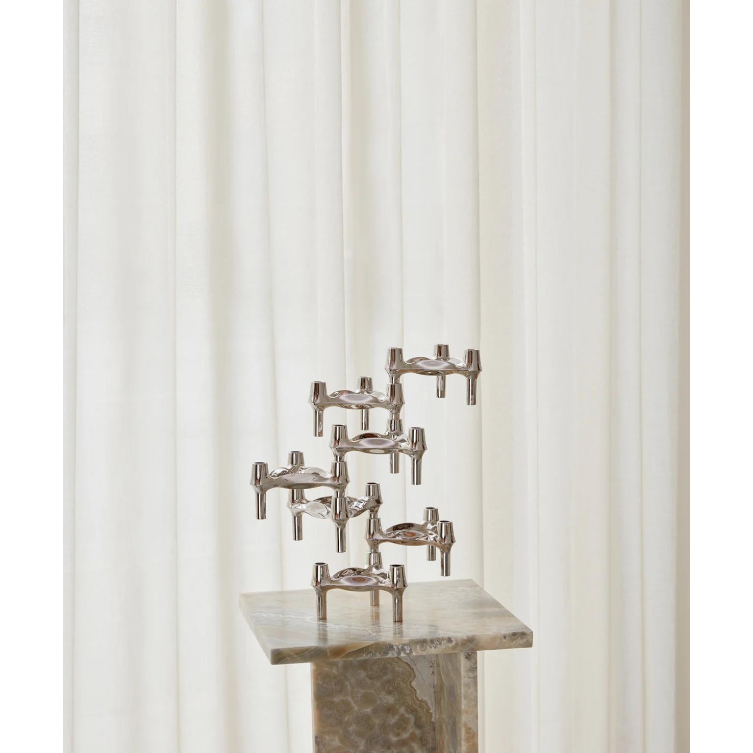 Set of 3 Decorative BMF Candle Holders in Chrome Finish by STOFF Nagel
Dimensions: Ø 11,7 x H 6,7 cm. 
Materials: Chrome.

Available in different finish options. Prices may vary. Please contact us. 

The BMF candle holder is among the most iconic