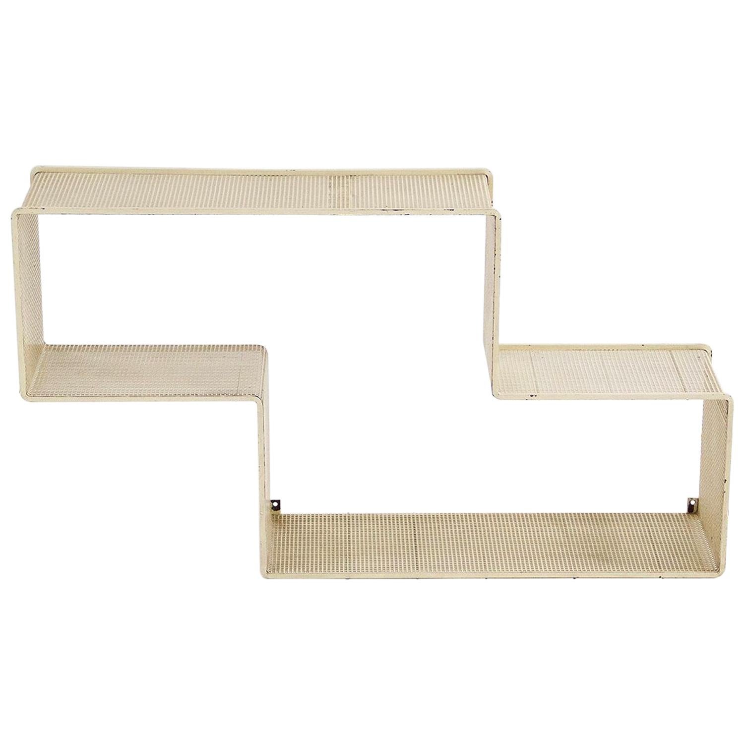 Set of 3 Dedal wall shelf designed by Mathieu Matégot.
Made of perforated steel. Preserving the original patina,
France, circa 1950. Manufactured in France by Ateliers Matégot.