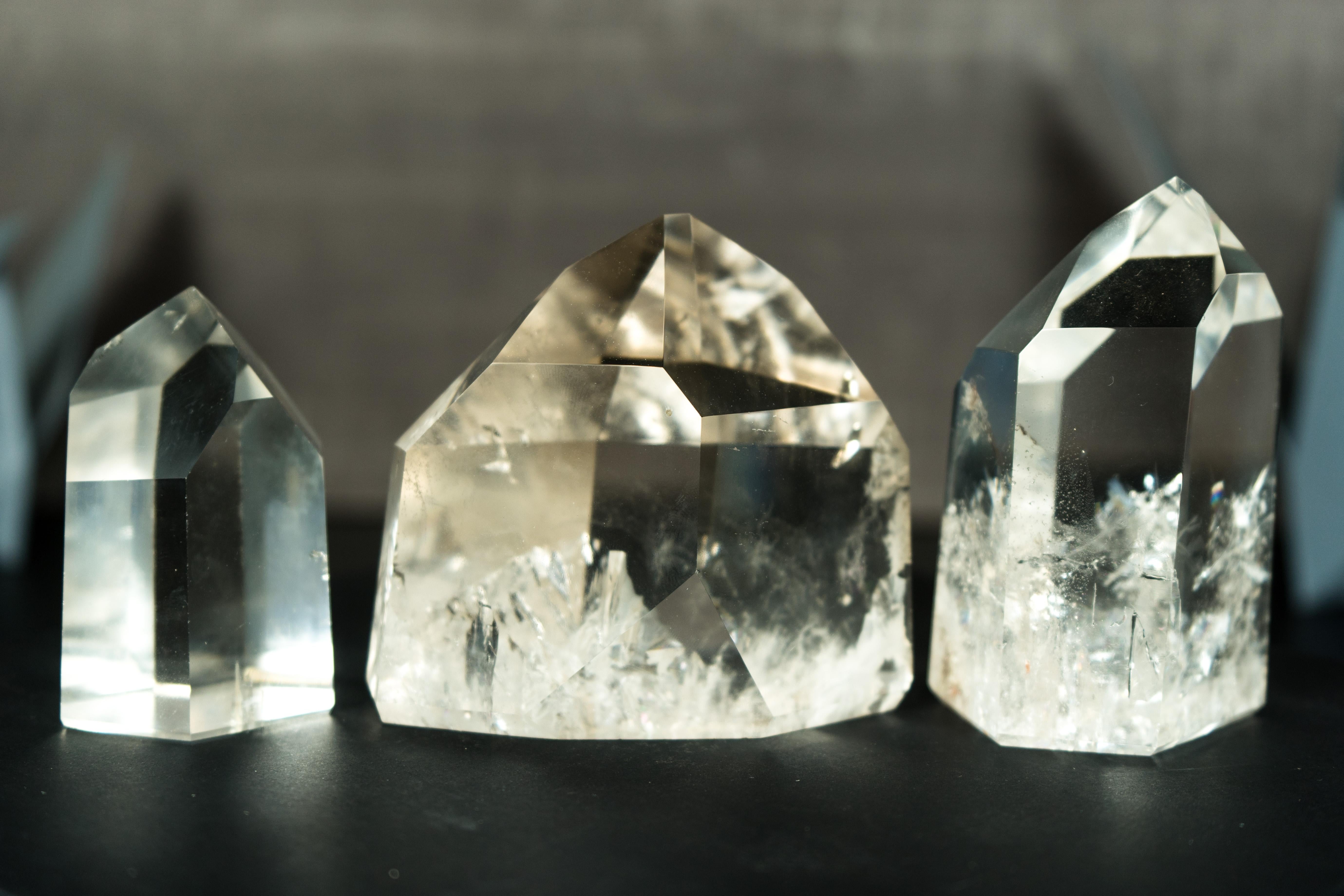 A small set of three crystal point generators, this lot was meticulously handpicked by me and is composed of AAA-grade Diamantina crystal quartz, renowned for its exceptional quality. Each crystal in this set was chosen because of its elegance,