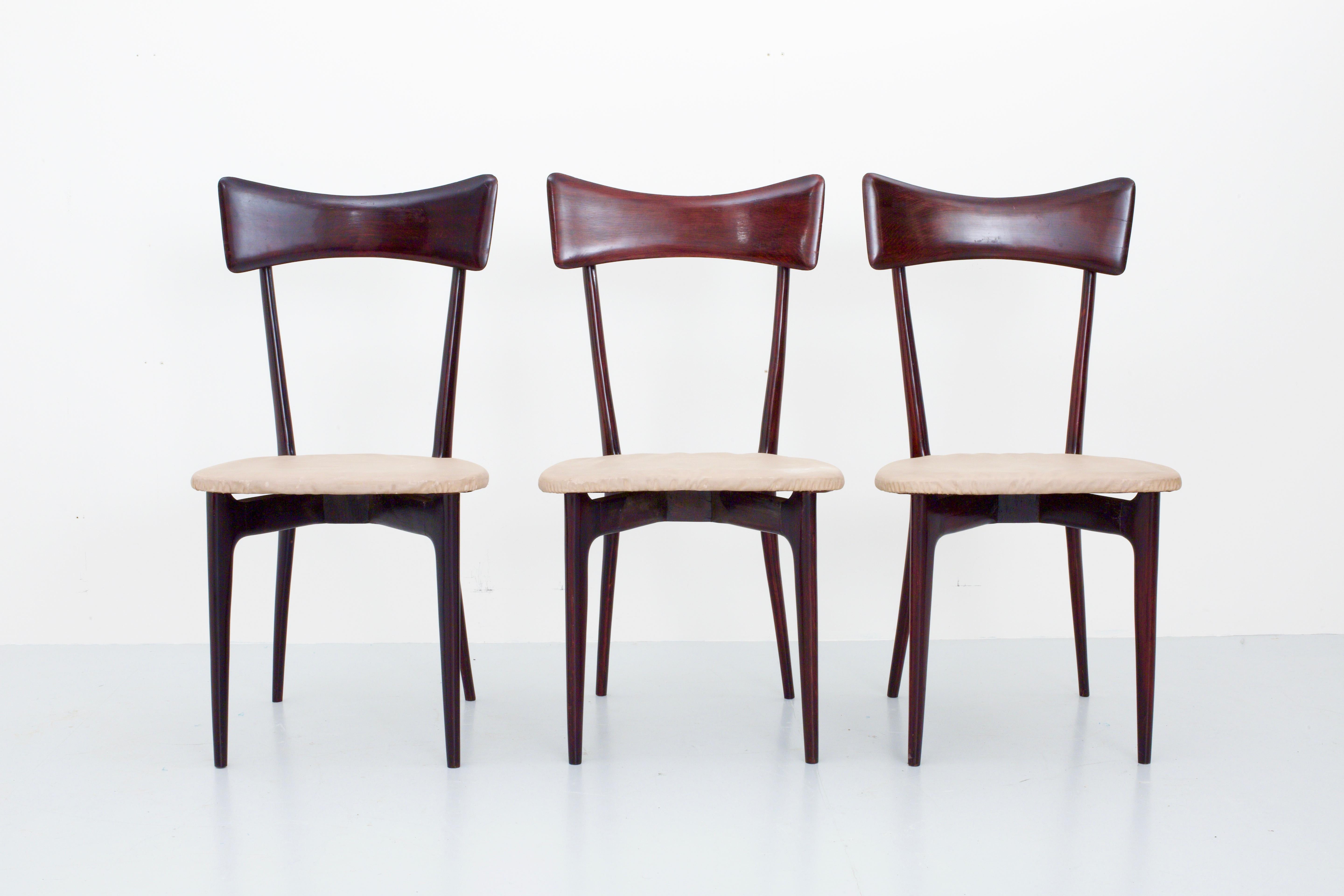 Set of three dining chairs in the well-known and typical style of Ico Parisi and his wife Luisa for Ariberto Colombo, Cantu, Italy, 1955. These chairs are a truly example of Italian design; elegant, round and light. With this beautiful patina still