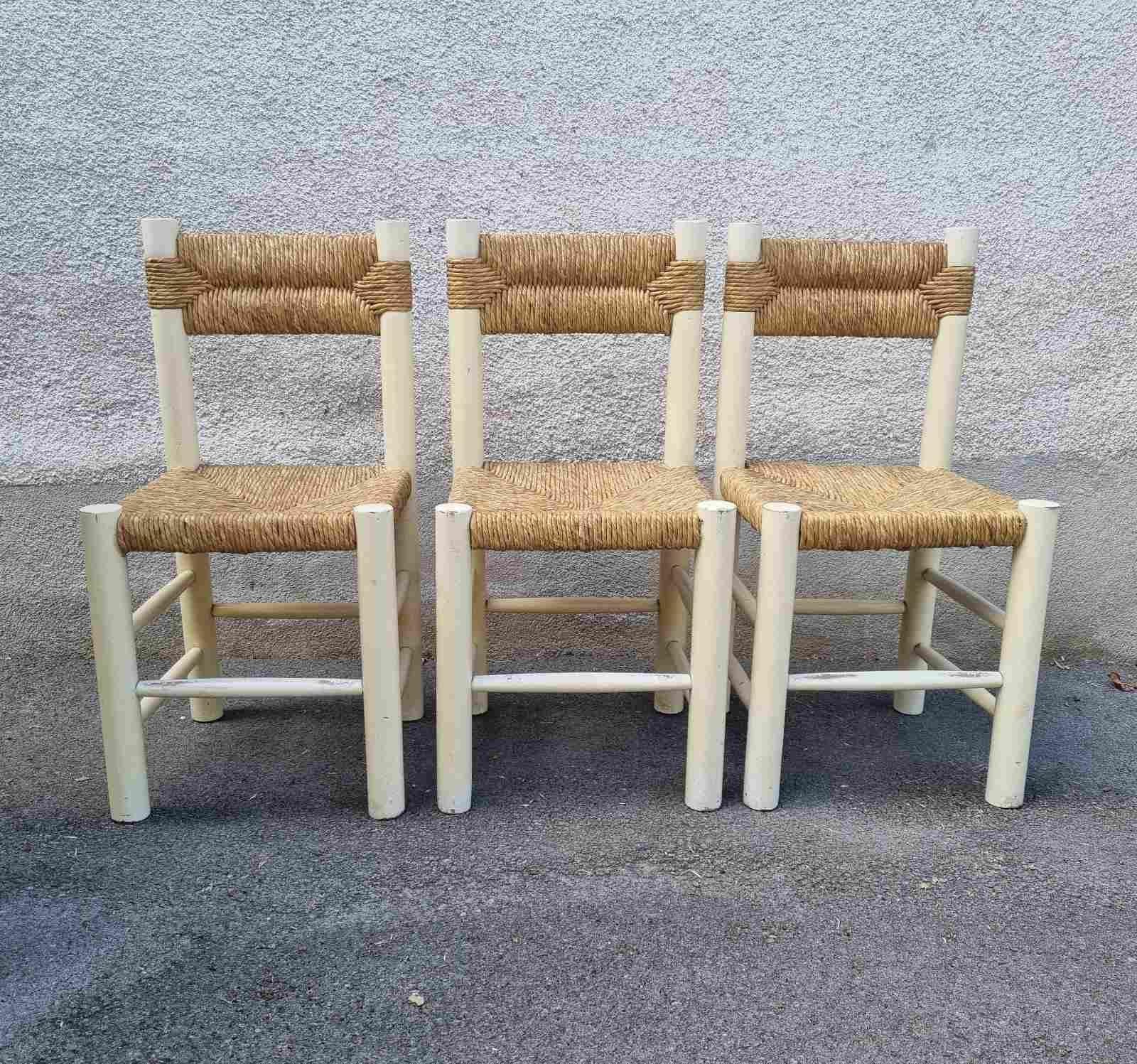Aet of three Dordogne dining chairs designed by Charlotte Perriand 
