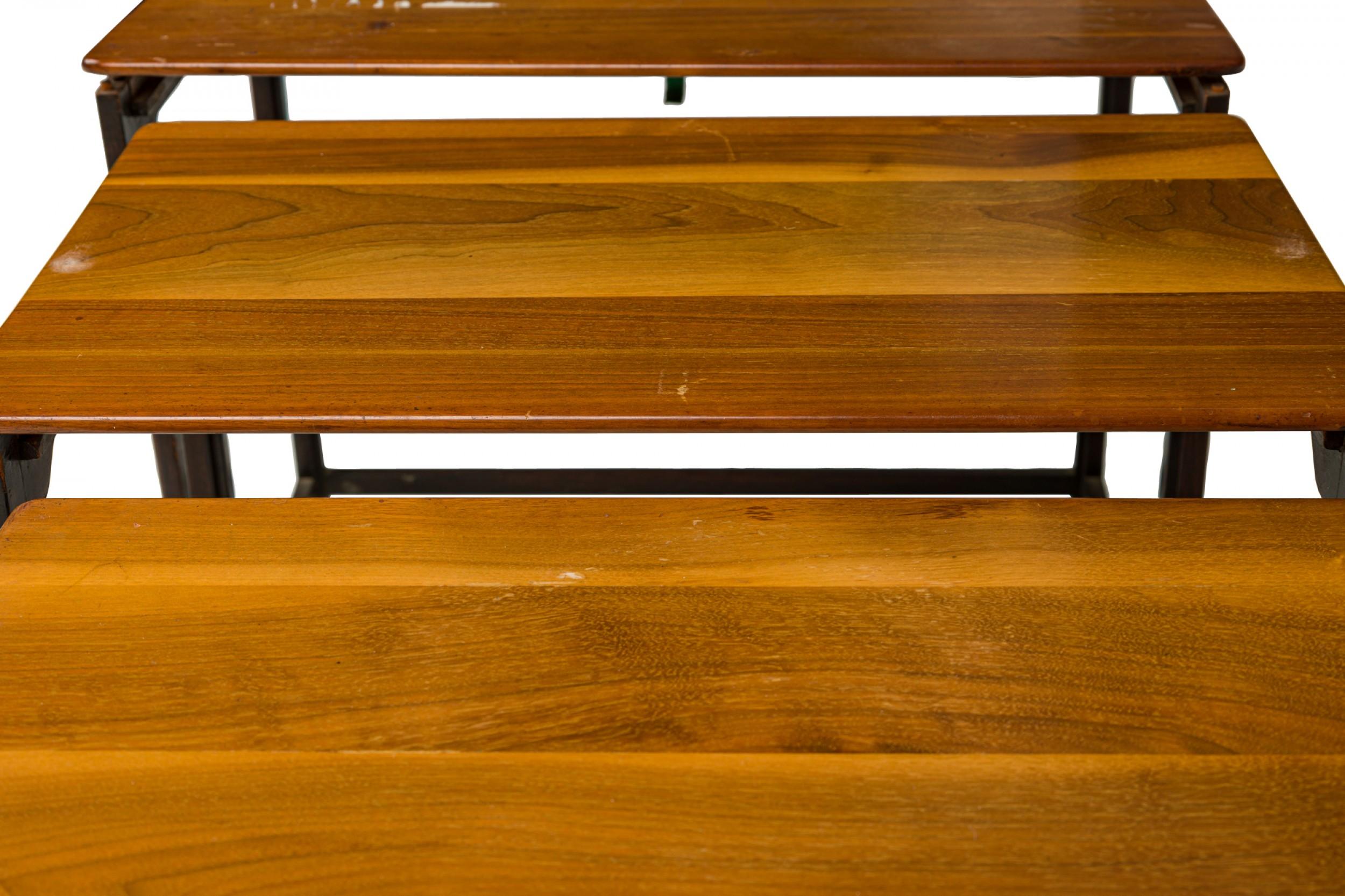 Set of 3 American Mid-Century nesting tables with finished wooden plank tops resting on iron frames. (EDWARD WORMLEY FOR DUNBAR FURNITURE COMPANY)(PRICED AS Set)

Wear to finish.