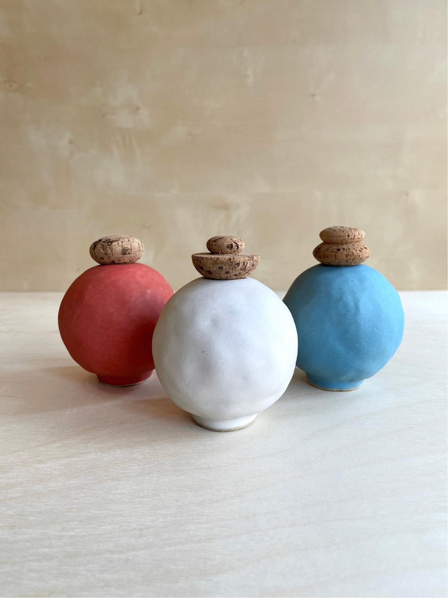 Set of 3 Edwina vases by Meg Morrison
One of a kind.
Materials: Ceramic, cork.
Dimensions: Ø 10 x H 13 cm (each).

All sizes are approximate. Although vases are watertight condensation may form on the bottom. Please protect delicate surfaces.