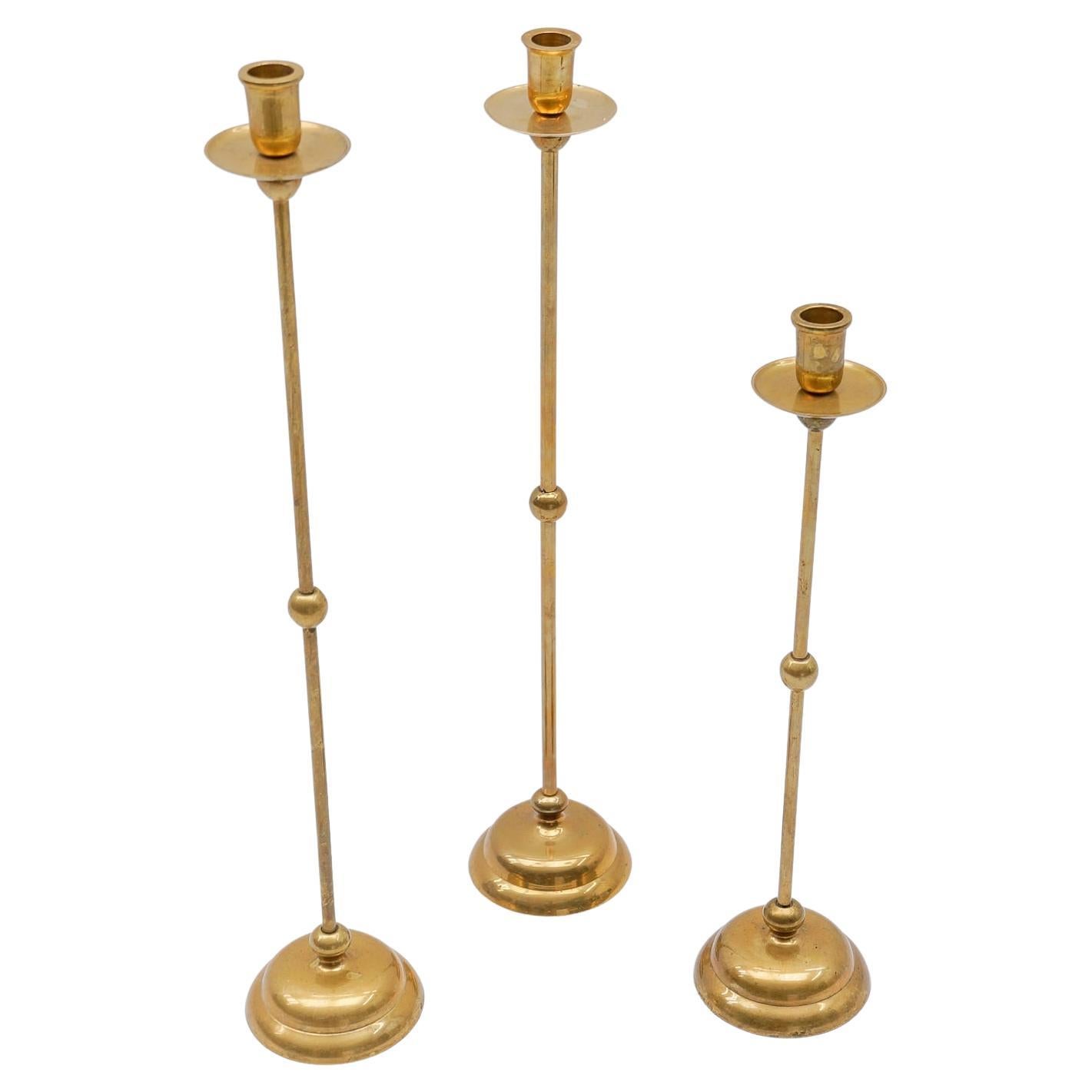 Set of 3 elegant Mid-Century Modern brass candle holder, 1960s For Sale