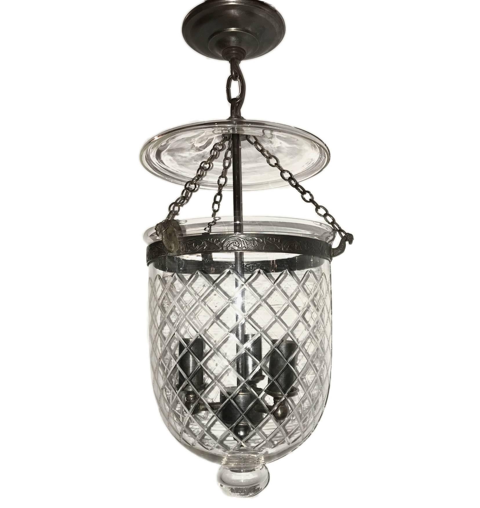 A set of etched glass lantern circa 1910 with criss cross pattern, three interior candelabra lights. 
Original smoke bell.

Priced individually.

Measures: 
10