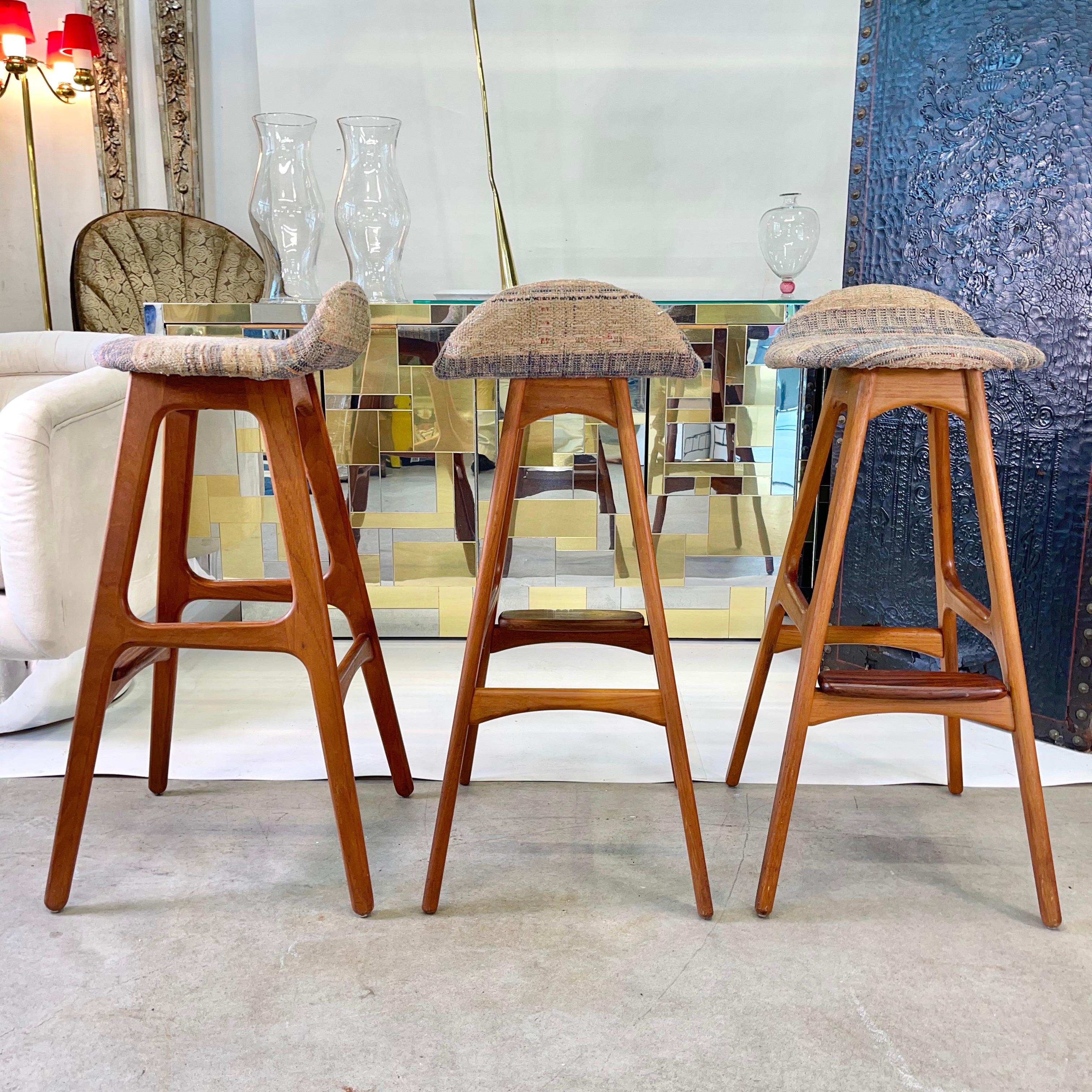 Original 1960s vintage O. D. 61 bar stools designed by Erik Buch (1923-1982) and made in Denmark by Oddense Maskinsnedkeri A-S.
Teak frame with a rosewood foot rest.
Woven textile upholstered seats in clean condition.
If requested we can have