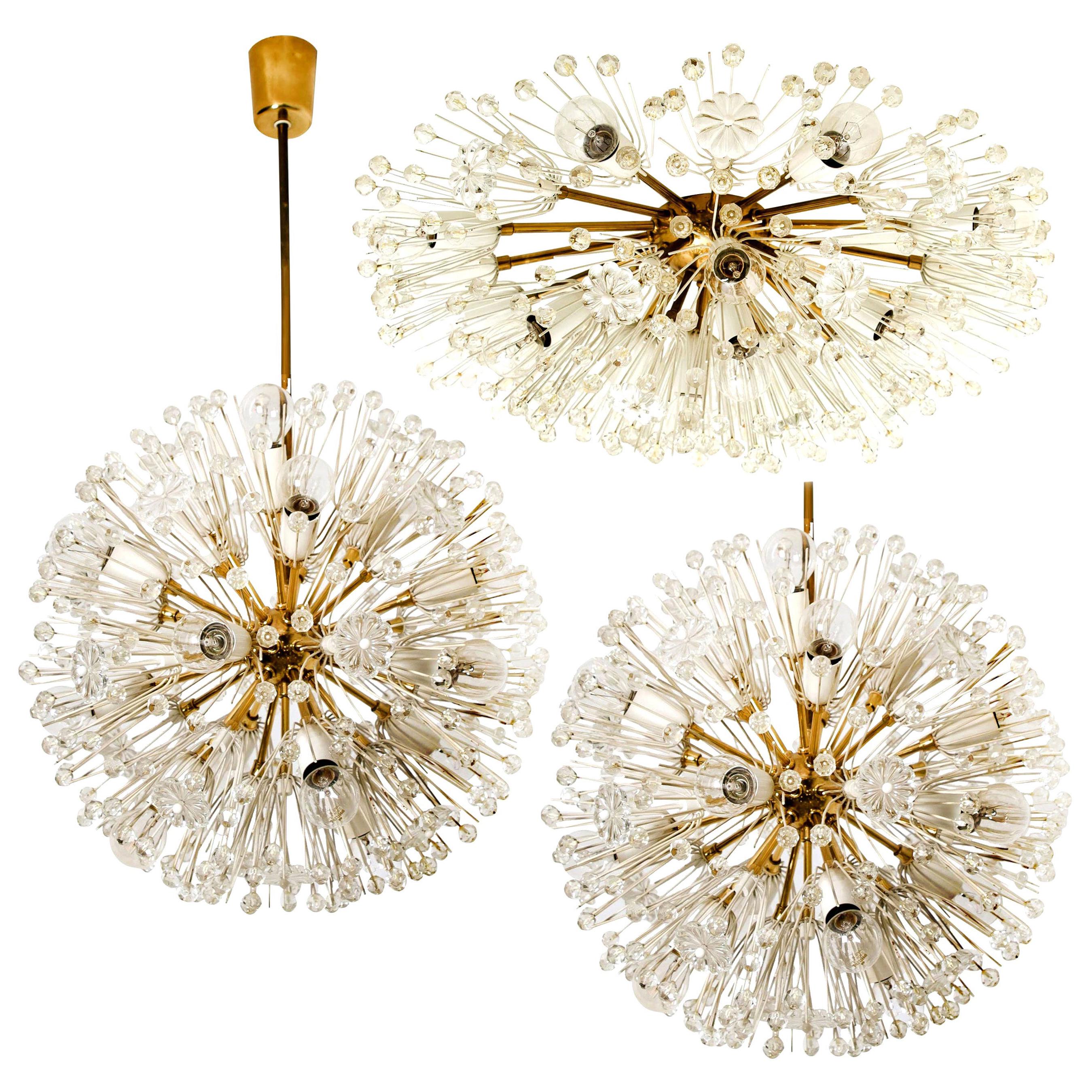 A magnificent set of light brass Sputnik fixtures with copious amounts of Austrian crystals by Emil Stejnar for Nikoll. Cosmological. 
This glamorous delicate brass ‘Snowball’ Sputnik light fixtures are also known as ‘pusteblume’ or ‘snowflake’ and
